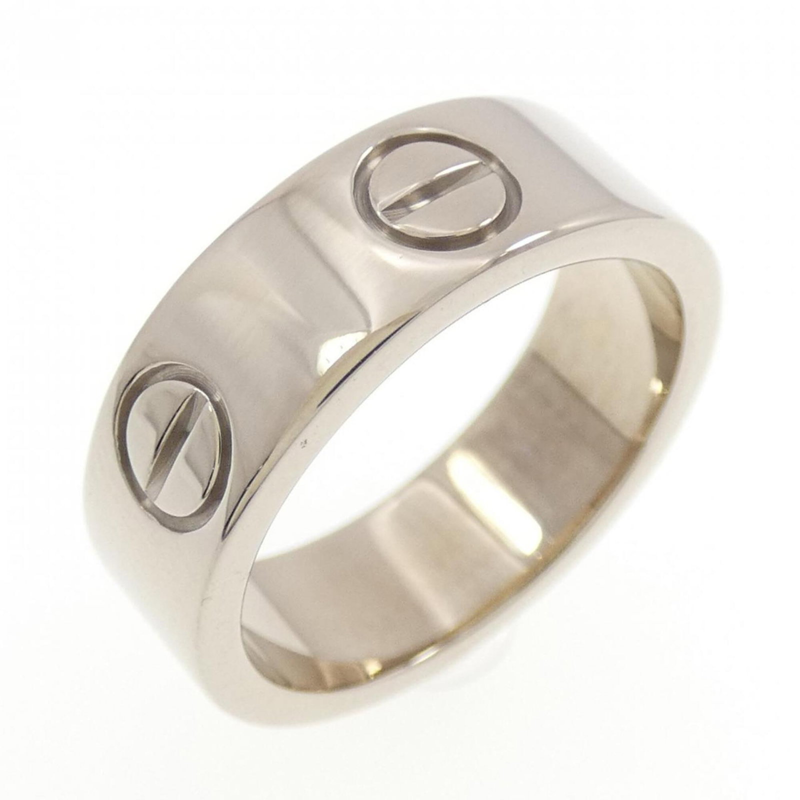 White Gold Cartier Band Ring 18K: White Gold Cartier Band Ring 18K White Gold Cartier Band Ring 18K features an 18K white gold band, bearing a signature. This used ring is in very good condition with some traces of usage and minor