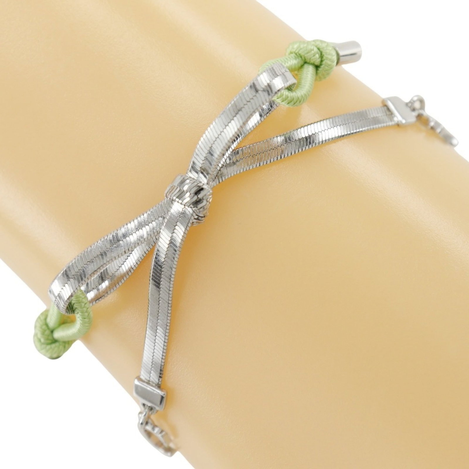 Dior Charm Rubber Metal Bracelet: Dior Charm Rubber Metal Bracelet The Dior Charm Rubber Metal Bracelet boasts a unique blend of silver and rubber, with a striking green hue. Its 20cm length provides a versatile fit for everyday wear.