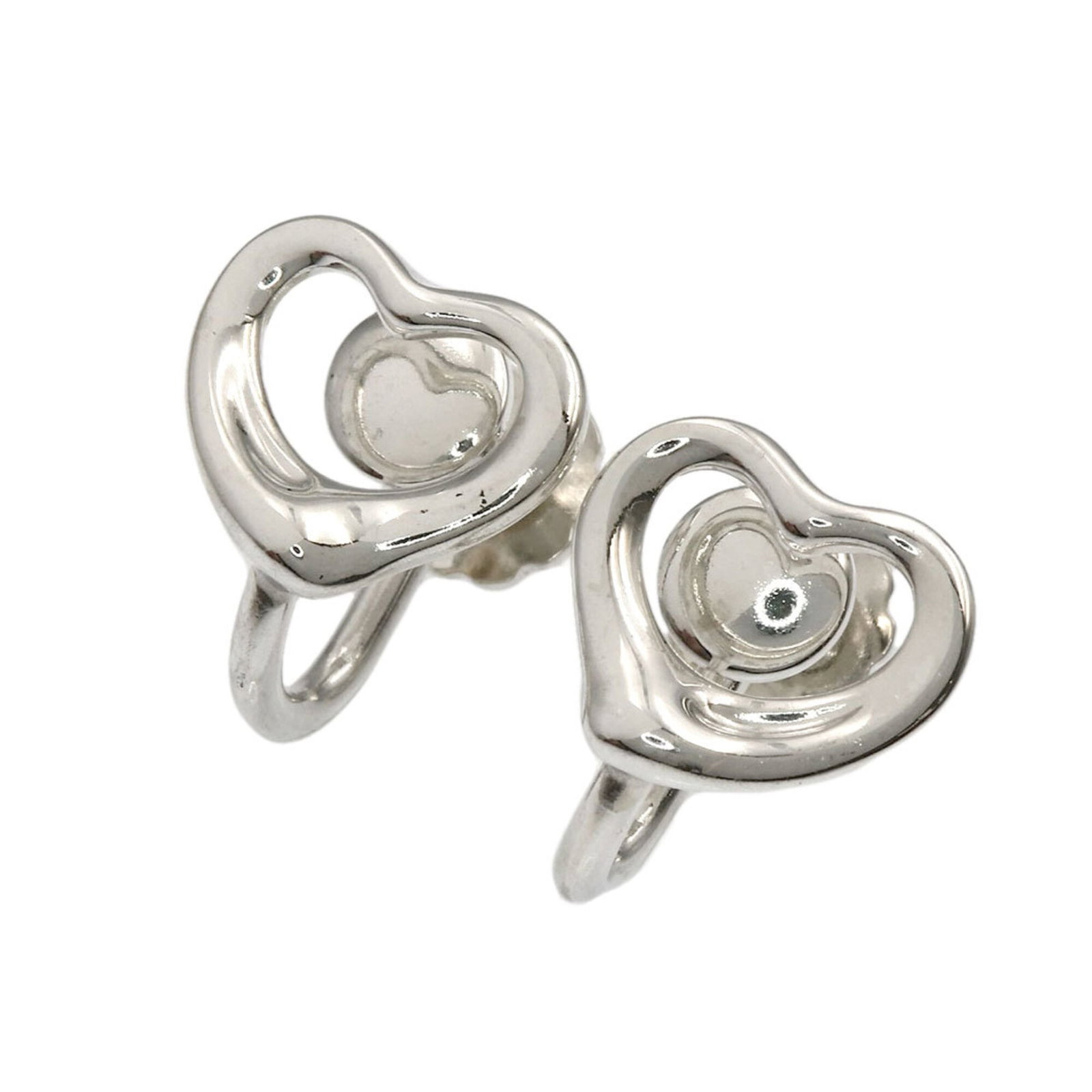 Clip earrings silver by Tiffany: Clip earrings silver by Tiffany Silver Clip Earrings by Tiffany, featuring a sleek and modern design. Made from high-quality silver, these clip earrings showcase a subtle shine that adds a touch of so