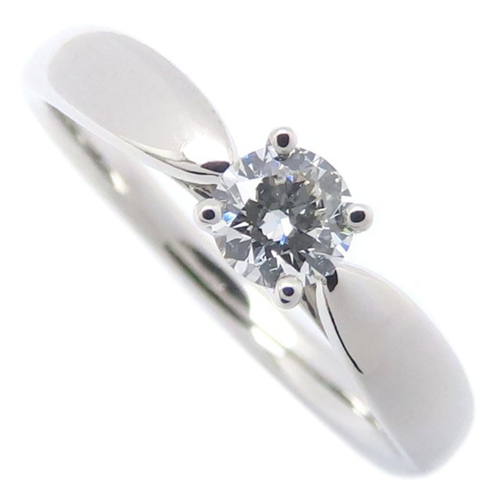 Platinum ring by Tiffany band: Platinum ring by Tiffany band Platinum ring by Tiffany & Co. showcases a stunning diamond set in a sleek band, boasting a 0.20 carat F color, Vs1 clarity diamond. The platinum construction provides a 