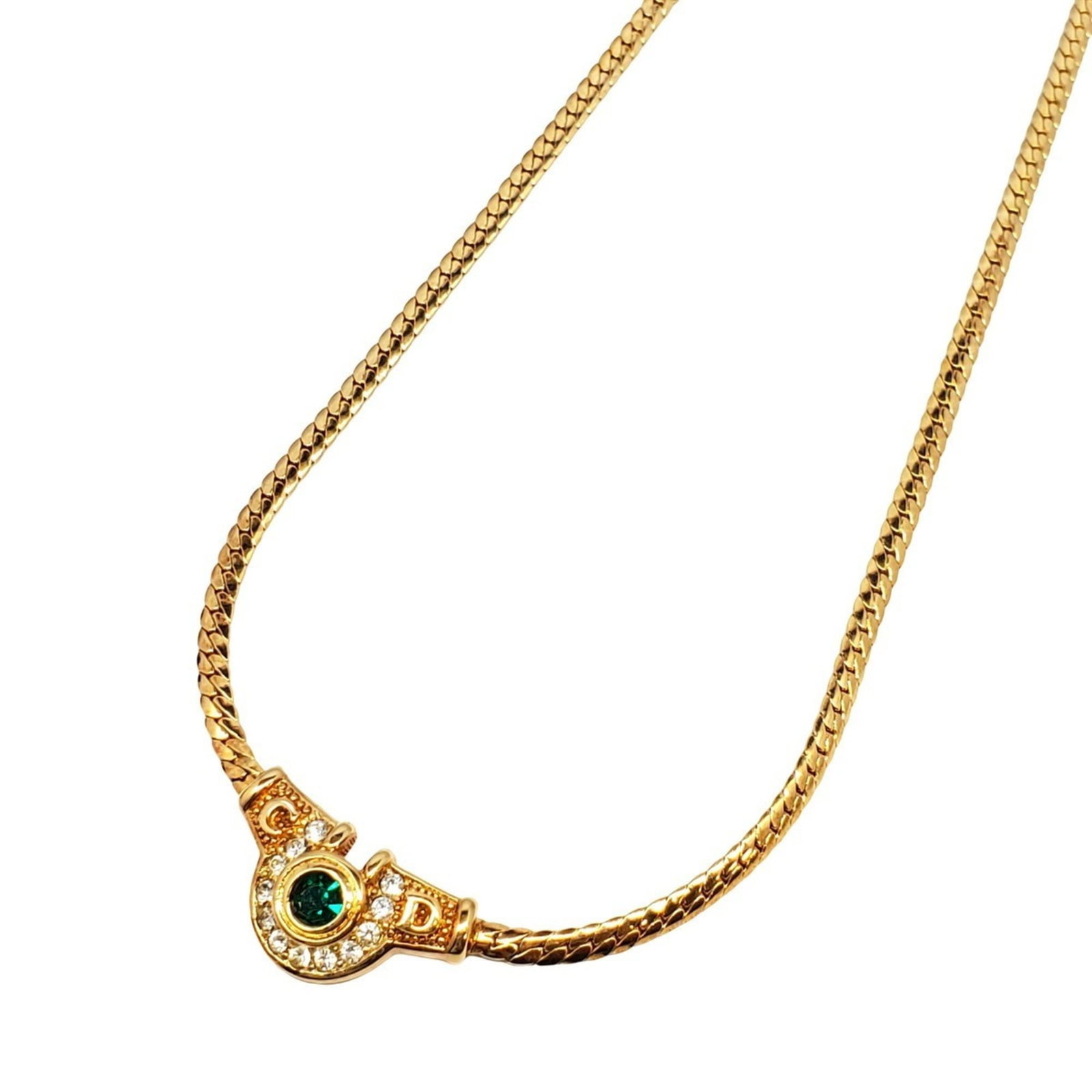Christian Dior Rhinestone Necklace In Gold Plated Green Kaizuka Store: Christian Dior Rhinestone Necklace In Gold Plated Green Kaizuka Store Gold Plated Green Rhinestone Pendant Necklace from Christian Dior. This elegant necklace features a striking green rhinestone pend