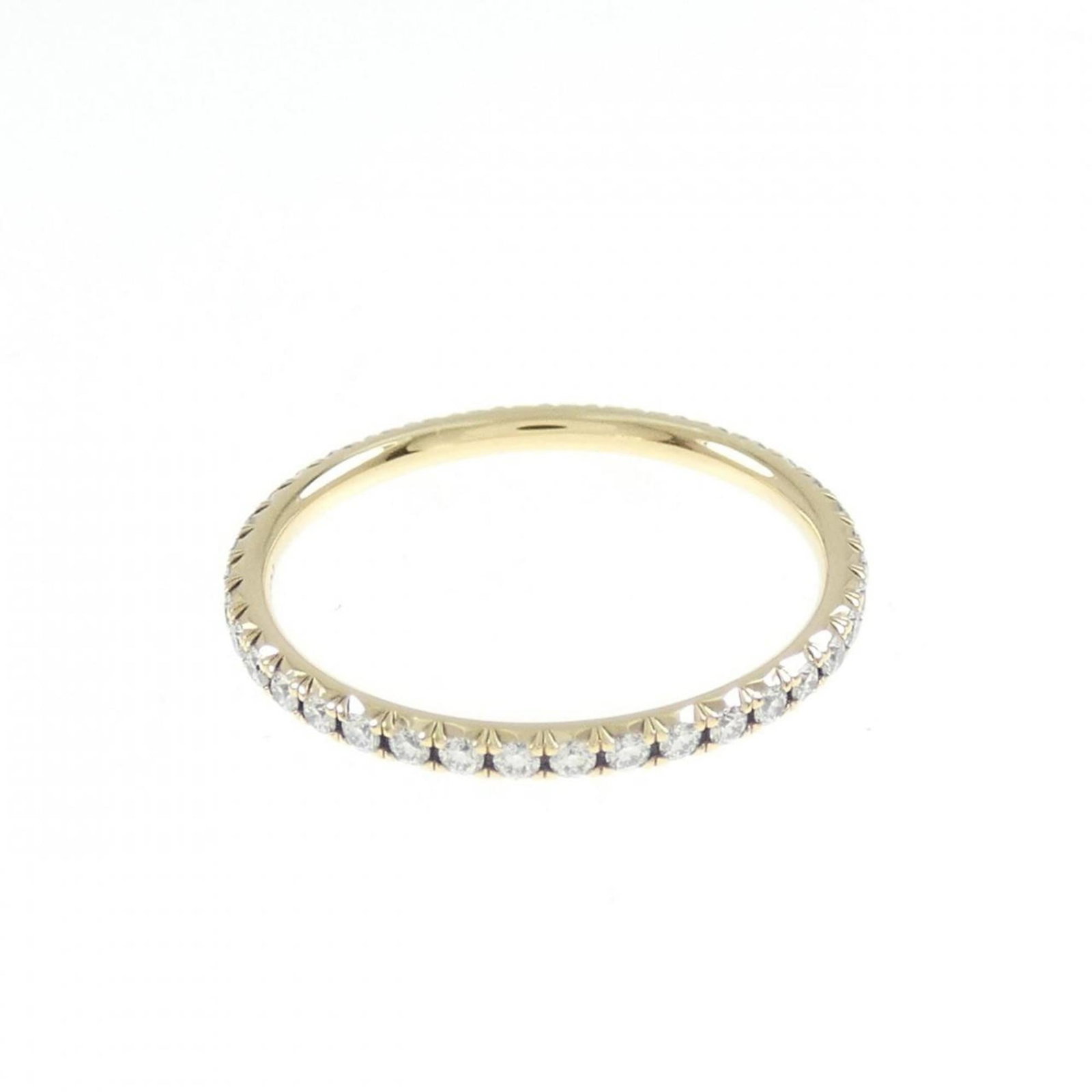 Tiffany Ring Gold Yellow 18K: Tiffany Ring Gold Yellow 18K Yellow gold band ring with a diamond stone, crafted in 18K. The ring bears some scratches and minor dirt, but remains in very good condition overall. A few traces of usage