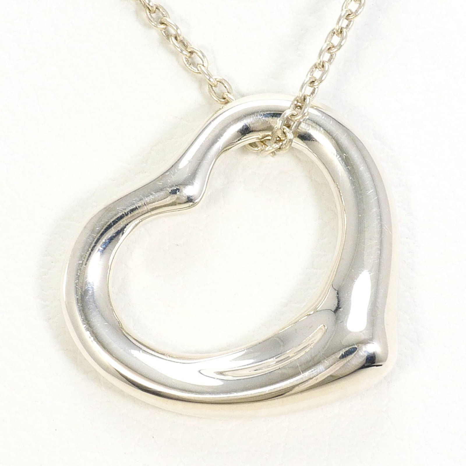 Tiffany & Co. Open Heart Sterling Silver Necklace Approx. 16.5 Inches (40Cm) Total Weight: 2.9G.: Tiffany & Co. Open Heart Sterling Silver Necklace Approx. 16.5 Inches (40Cm) Total Weight: 2.9G. Tiffany & Co. Open Heart Sterling Silver Necklace boasts an elegant design with a 14mm x 15mm open