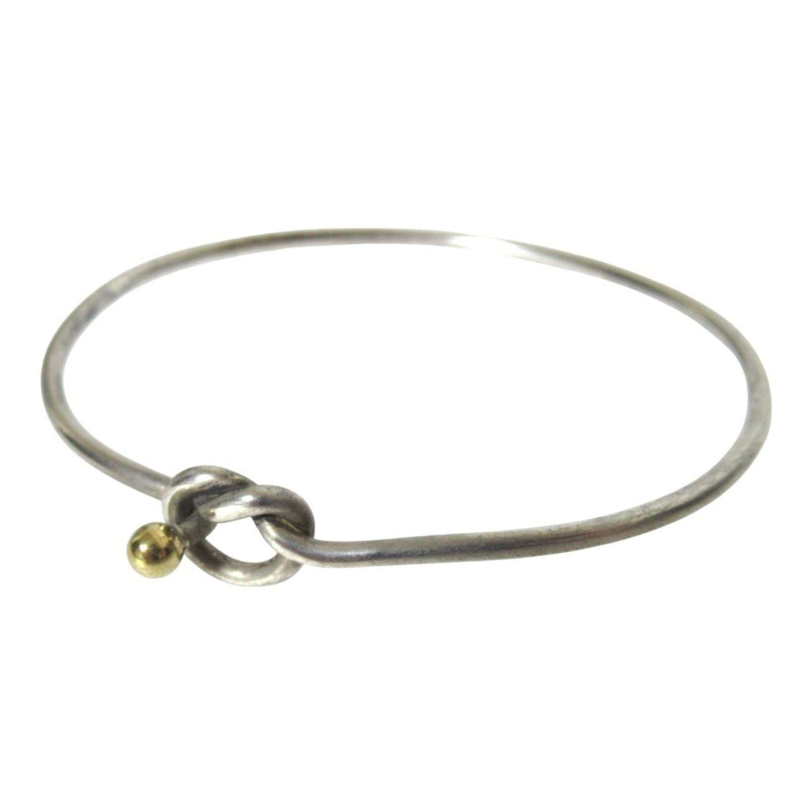 Tiffany Bangle Gold (18K) Silver 925: Tiffany Bangle Gold (18K) Silver 925 This vintage Tiffany bangle boasts intricate design and luxurious gold (18K) and silver 925 details. Measuring 16cm in length, its classic style makes it a timeles