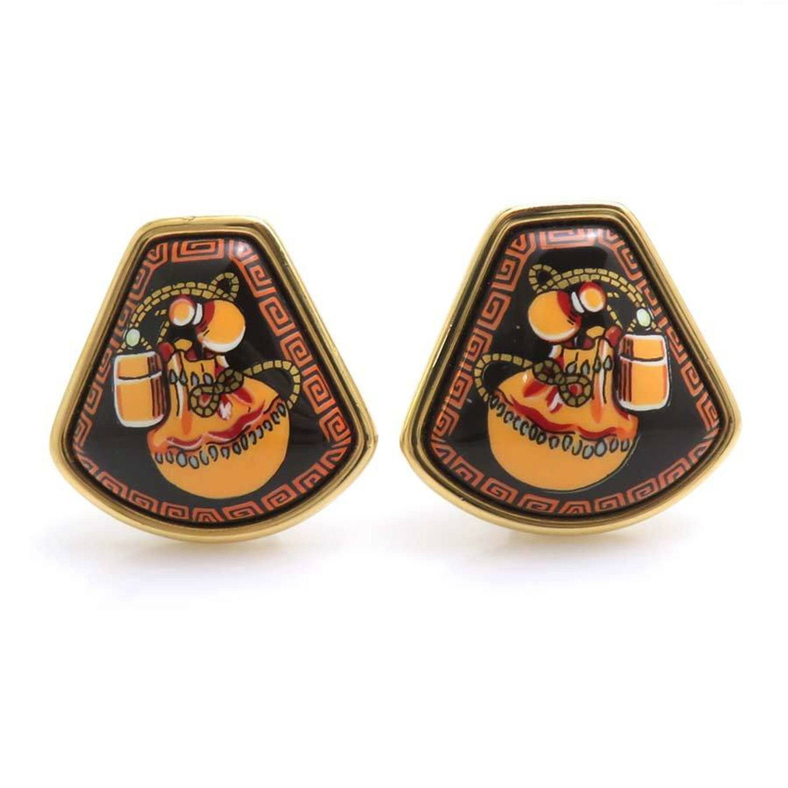 Enamel metal Hermes earrings clip: Enamel metal Hermes earrings clip Enamel metal Hermes earrings clip in black, gold, and orange hues, featuring a distinctive clip design. The item bears traces of usage and minor scratches/dirt, indic