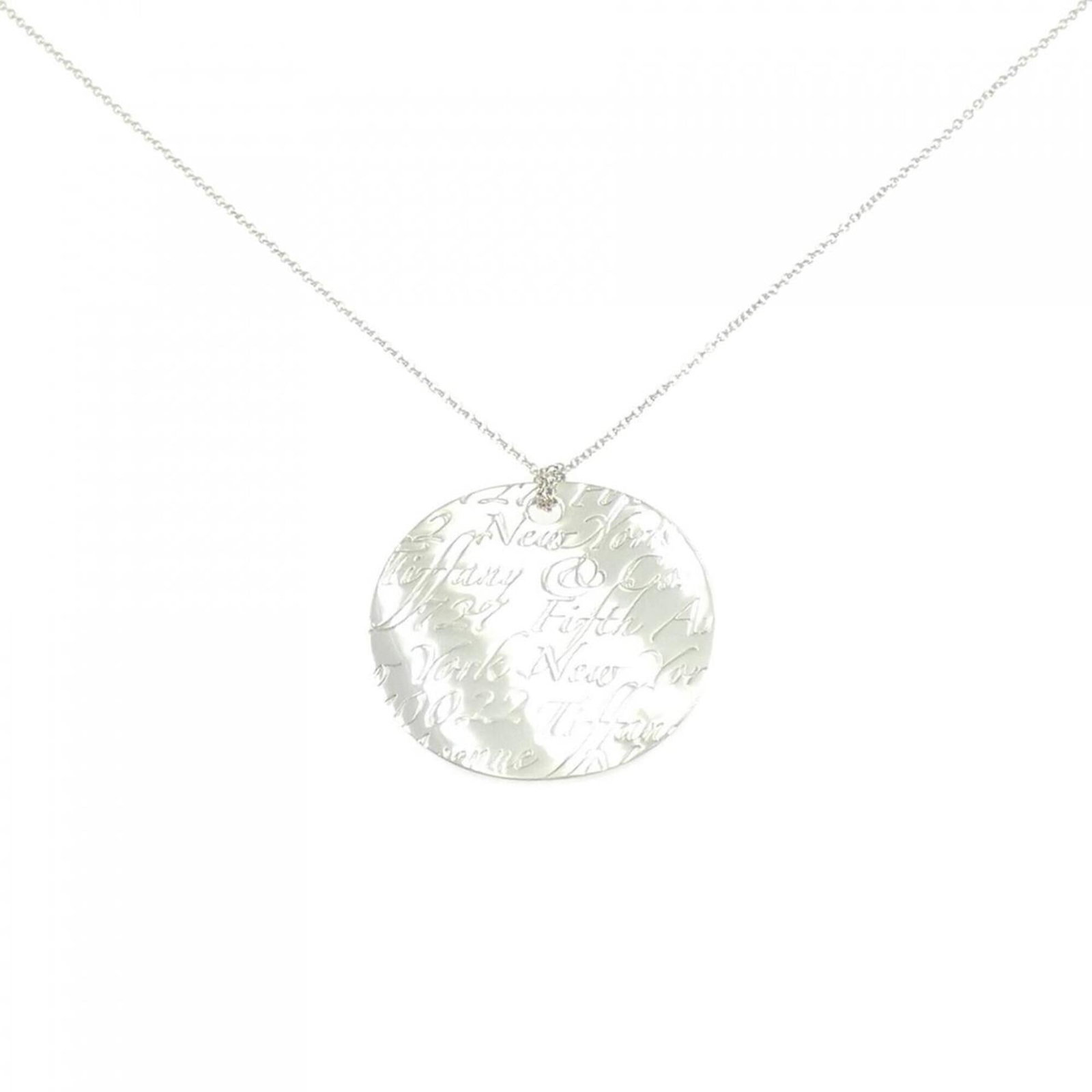 Tiffany Notes Round Large Necklace: Tiffany Notes Round Large Necklace Silver 925 Tiffany Notes Round Large Necklace, featuring a large pendant with a subtle design. The necklace has a comfortable 46 cm neck circumference and bears a fe