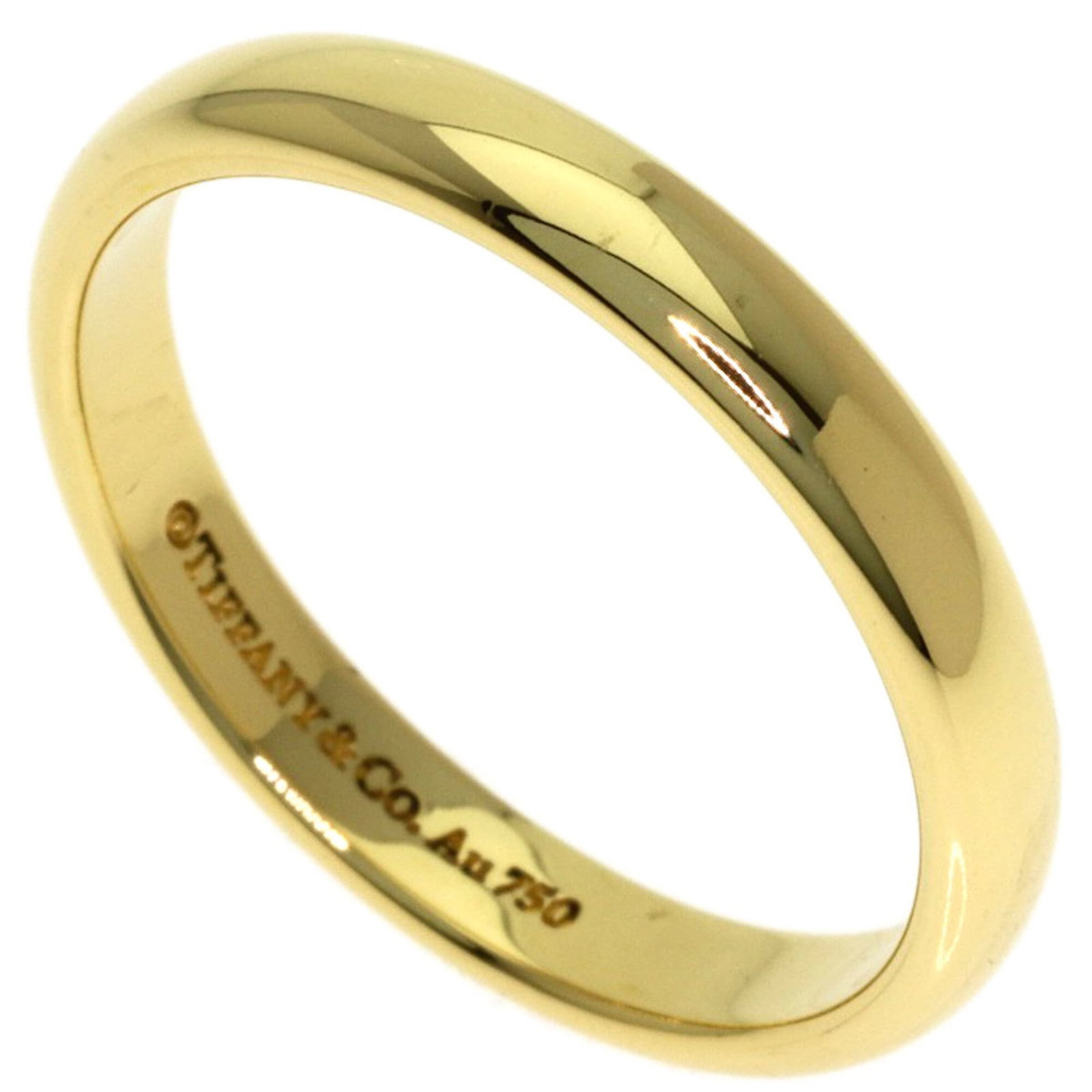 Tiffany Ring Gold Yellow 18K: Tiffany Ring Gold Yellow 18K Yellow gold (18K) band ring from Tiffany, featuring a classic design. The ring shows some signs of usage, with a few scratches and minor dirt marks, but remains in very go