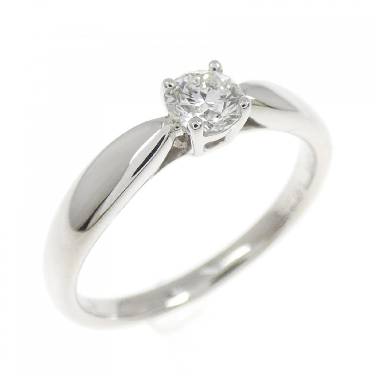 Platinum ring by Tiffany band: Platinum ring by Tiffany band Platinum ring by Tiffany features a diamond stone set in a band ring. The item has some scratches and dirt, but overall remains in very good condition with only a few