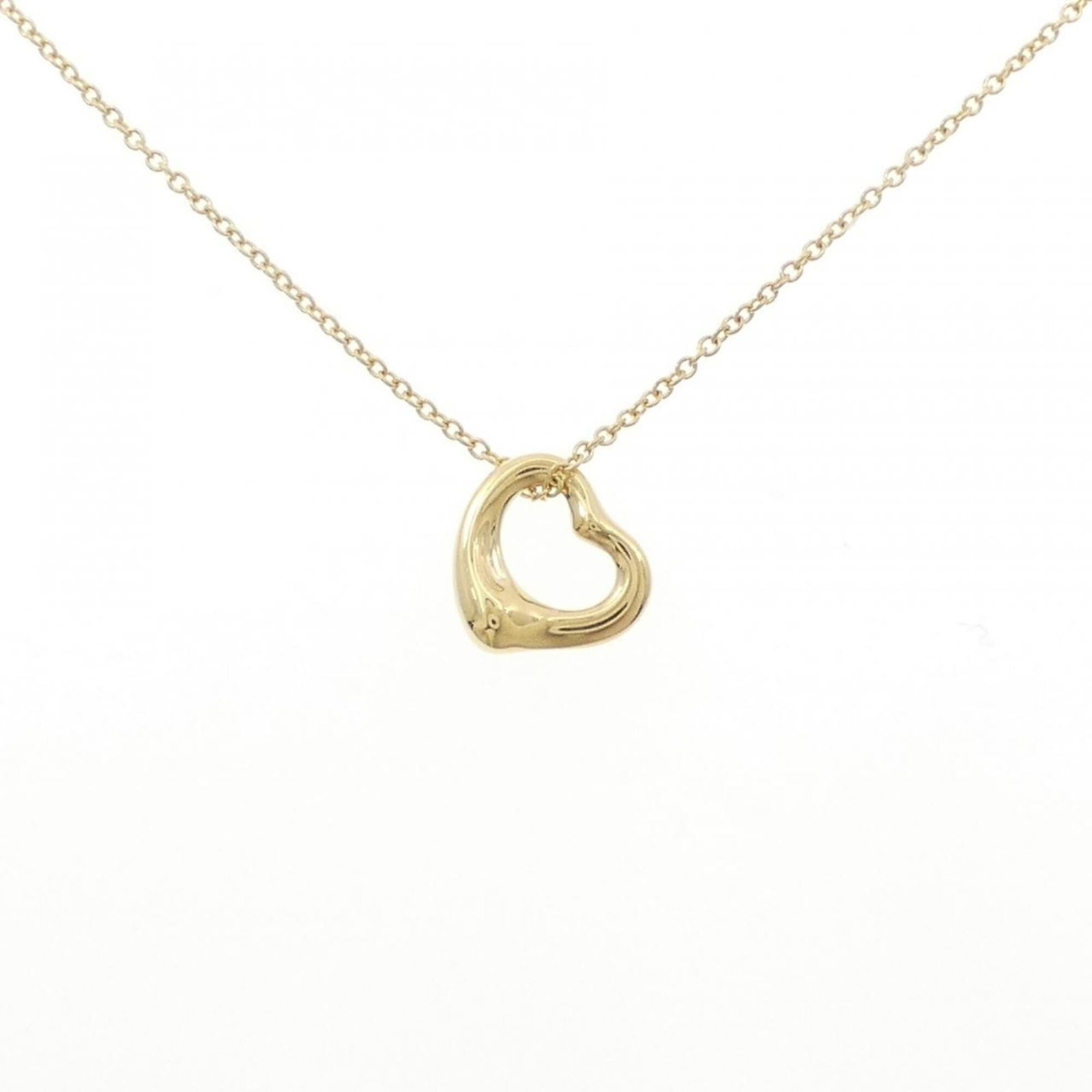 Heart Open Tiffany Necklace: Heart Open Tiffany Necklace Yellow Gold Heart Open Tiffany Necklace, featuring a 11mm x 10.8mm pendant with a subtle heart design, set in a yellow gold chain with a 42 cm circumference. This used neck