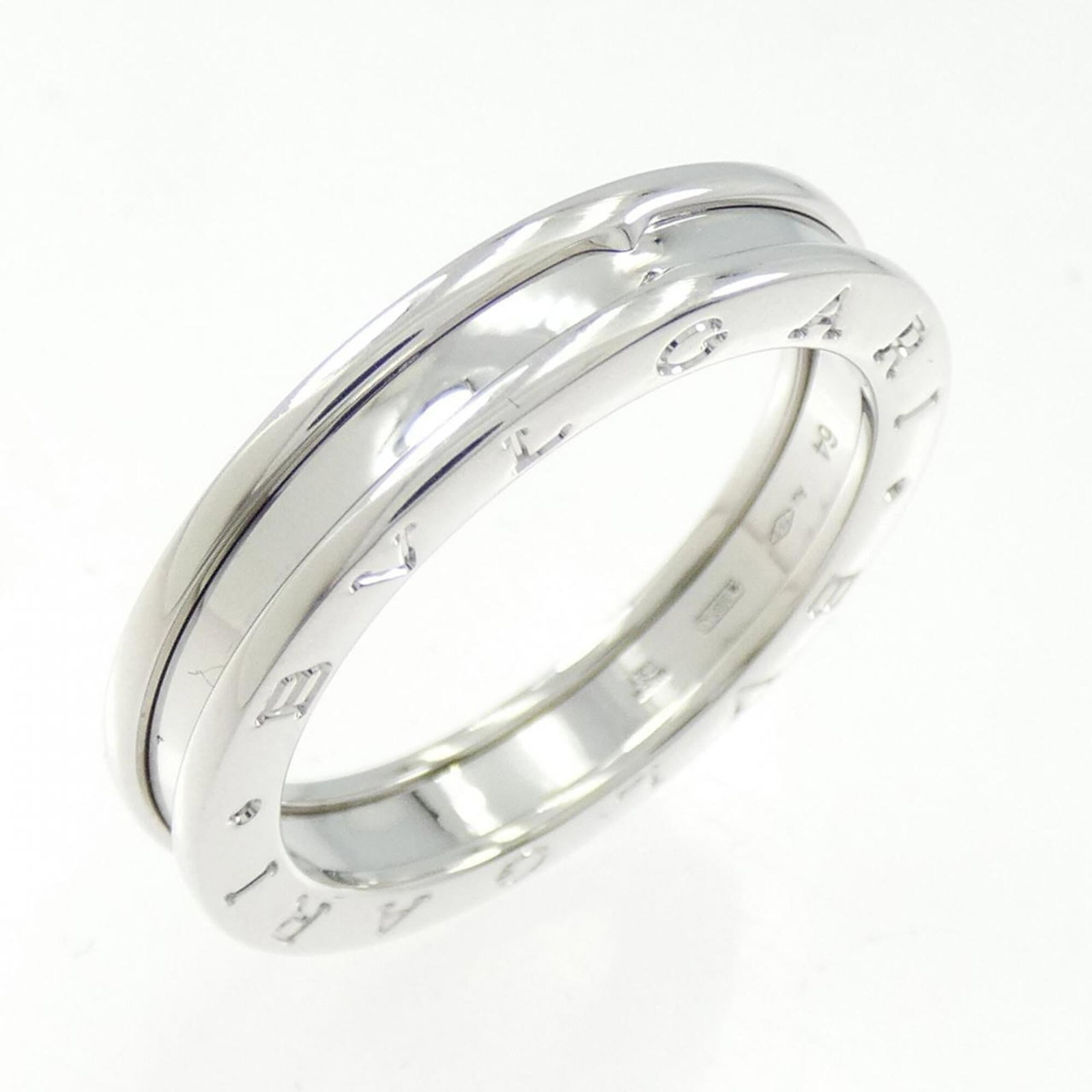 Bvlgari Band Ring White Gold (18K): Bvlgari Band Ring White Gold (18K) Bvlgari Band Ring White Gold (18K) - A refined and elegant accessory, this 18k white gold band ring boasts a sleek design that complements any style. Made from high-