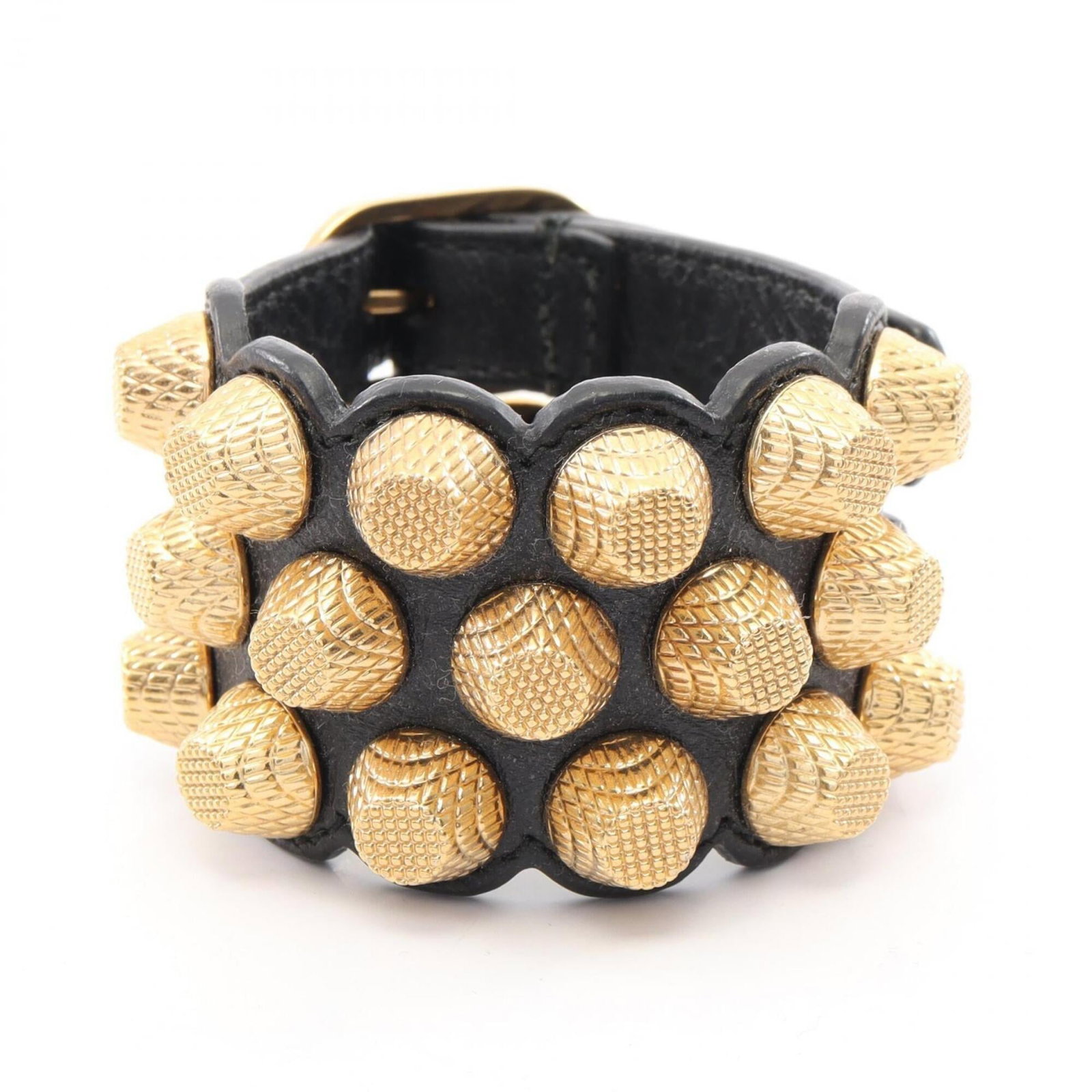Leather Bracelet Balenciaga Charm: Leather Bracelet Balenciaga Charm Black leather Balenciaga charm bracelet with gold accents, measuring 14cm-17cm in length. This used bracelet features some minor scratches and dirt, but remains in