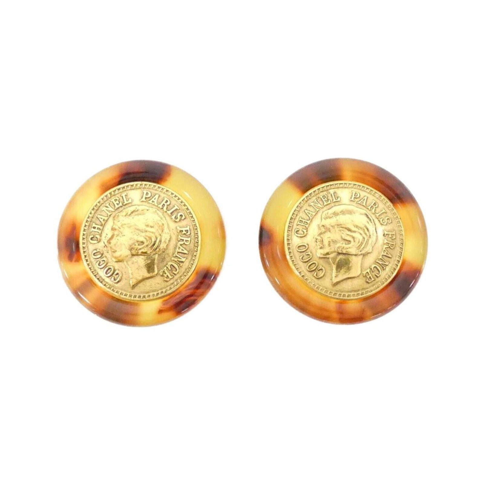 Chanel Clip Earrings: Chanel Clip Earrings Brown Chanel Clip Earrings with a subtle, elegant design. Made from high-quality materials, these earrings feature a classic clip-back style that adds a touch of sophistication