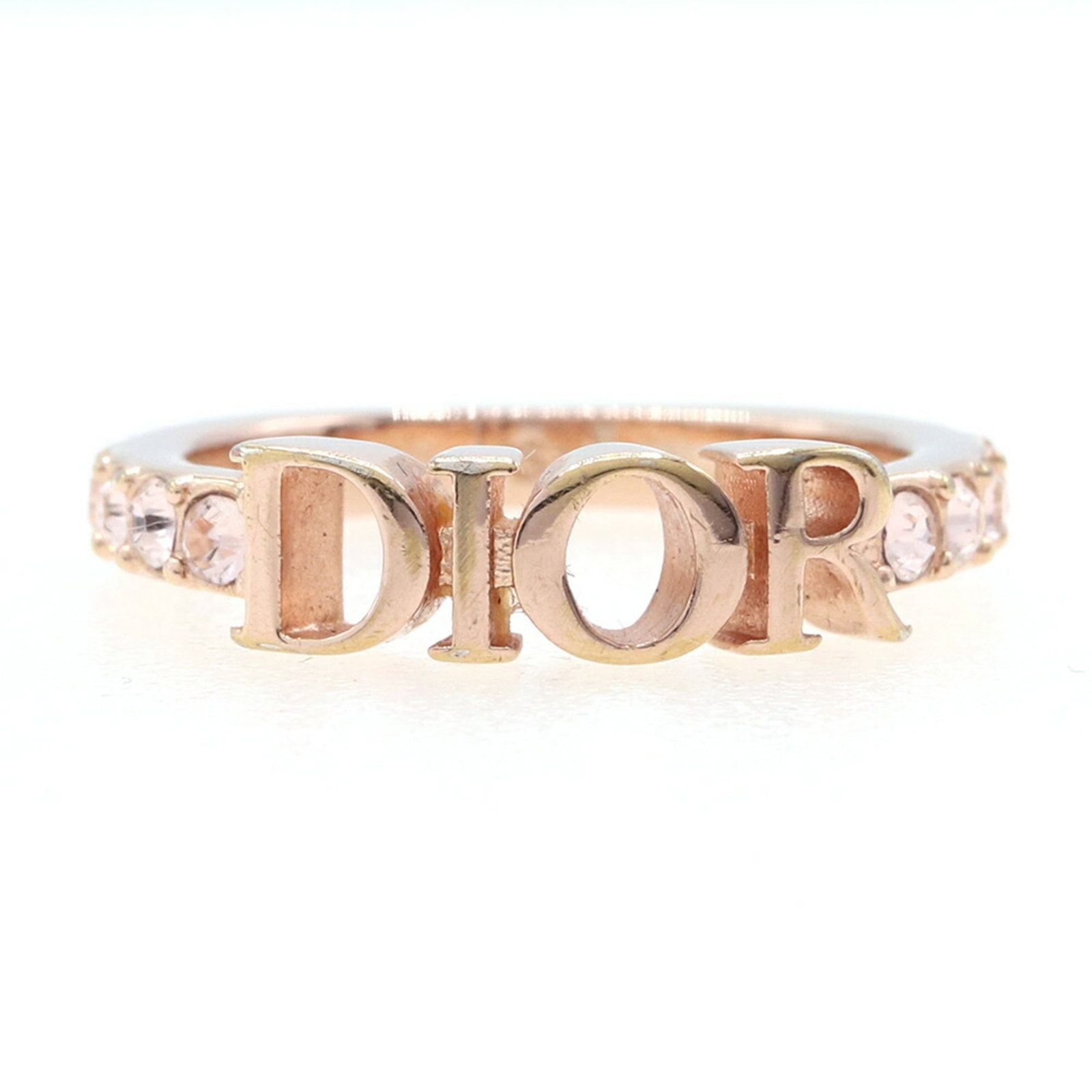 Dior Metal Ring Christian Band: Dior Metal Ring Christian Band Pink Gold Dior Metal Ring with Crystal Stone, a delicate band ring featuring a subtle pink hue and crystal accents, weighs 2.3g and measures 2.5mm in width. The ring is
