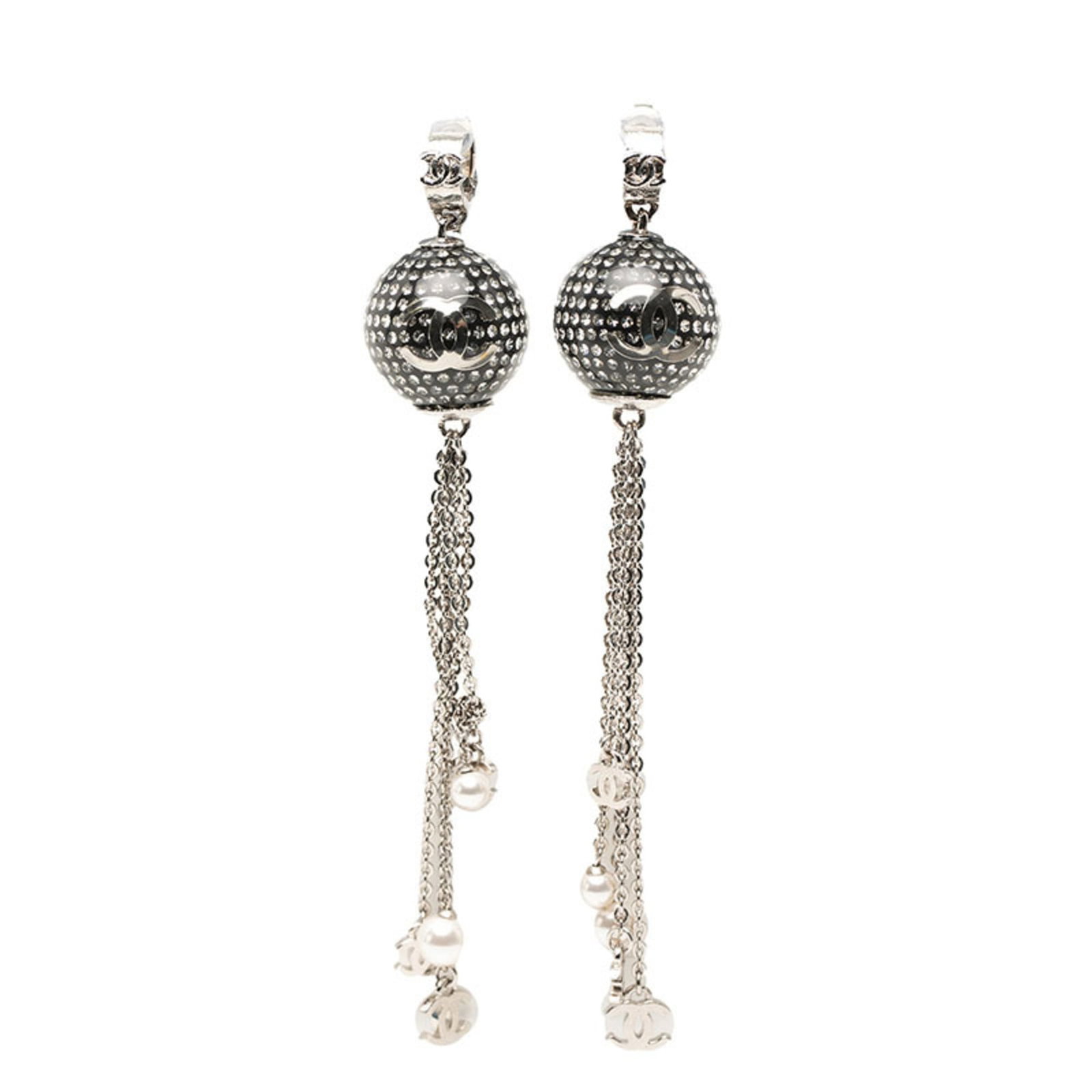 Metal Rhinestone Clip Chanel Earrings: Metal Rhinestone Clip Chanel Earrings Metal Rhinestone Clip Chanel Earrings are made from metal and adorned with rhinestones, giving them a luxurious look. The silver color adds to their sleek appeara