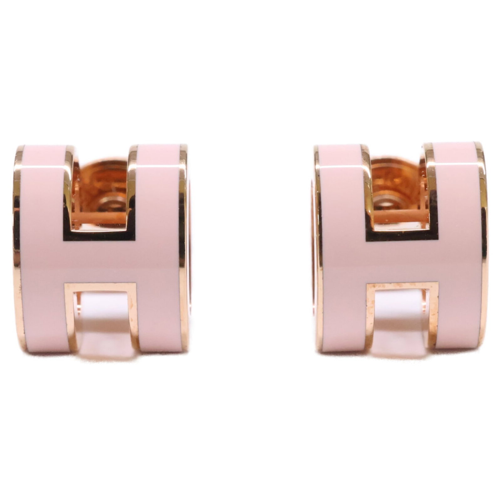 Hermes Stud Earrings Metal: Hermes Stud Earrings Metal Pink and pink gold stud earrings from Hermes, measuring 9.00mm x 7.00mm. The earrings bear some signs of usage, including a few scratches and dirt, but remain in very good