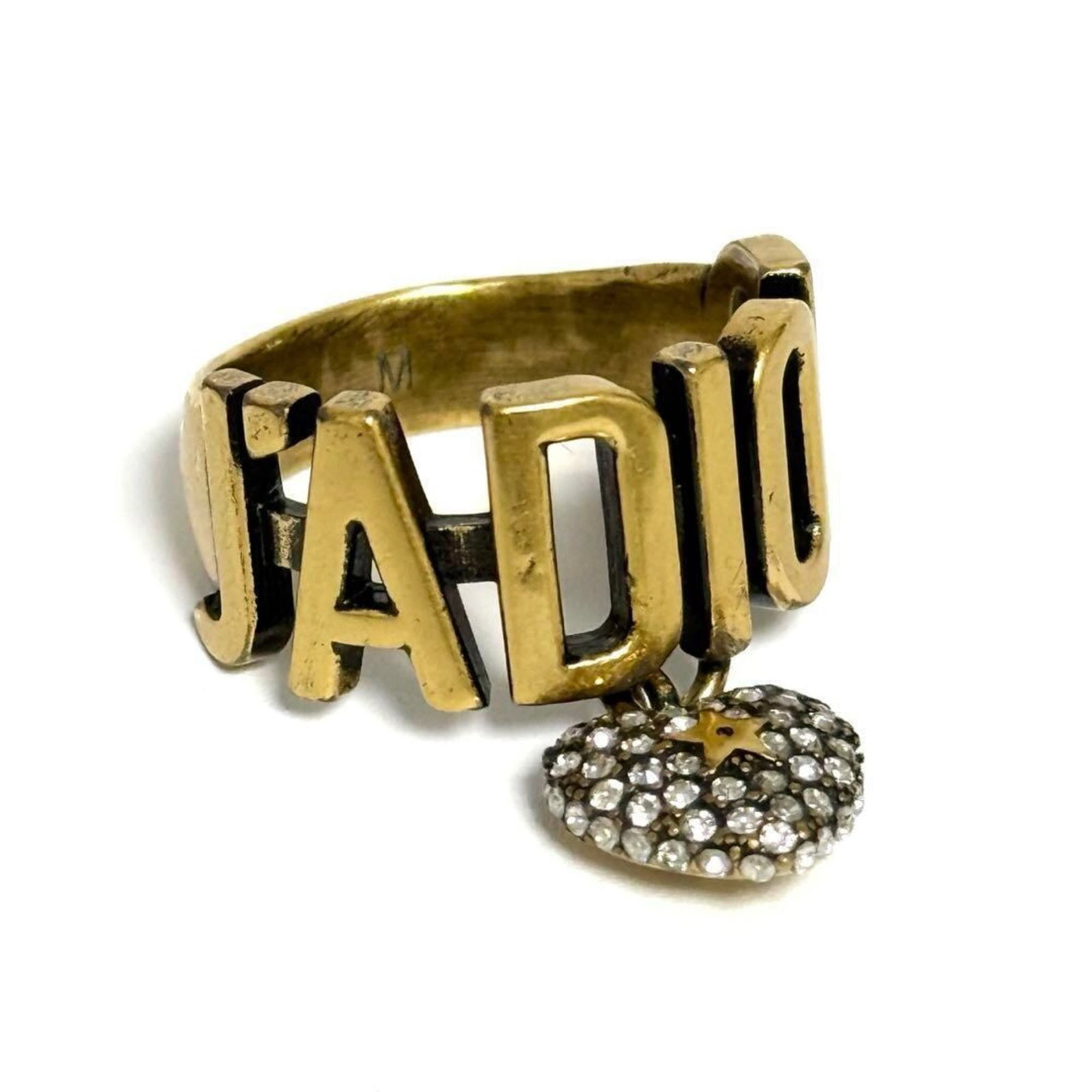 Metal Rhinestone Christian Dior Band Ring: Metal Rhinestone Christian Dior Band Ring Metal Rhinestone Christian Dior Band Ring features a striking metal and rhinestone design. The ring boasts a classic band style with prominent rhinestones,
