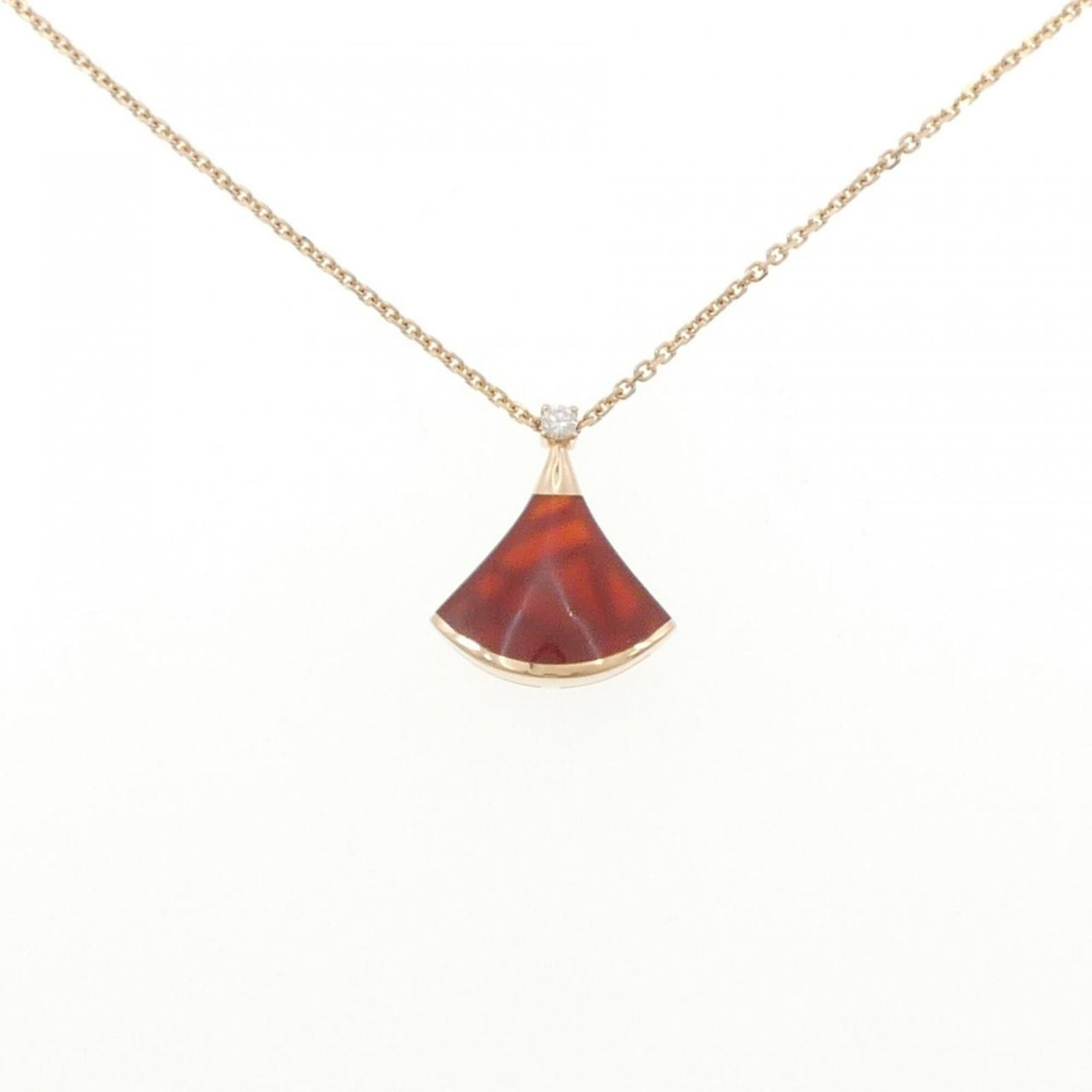 Dream Diva's Bvlgari Necklace: Dream Diva's Bvlgari Necklace Pink gold (18K) pendant featuring carnelian and diamond accents, set in a classic Bvlgari design. The necklace boasts a timeless elegance with its 41-43 cm circumference