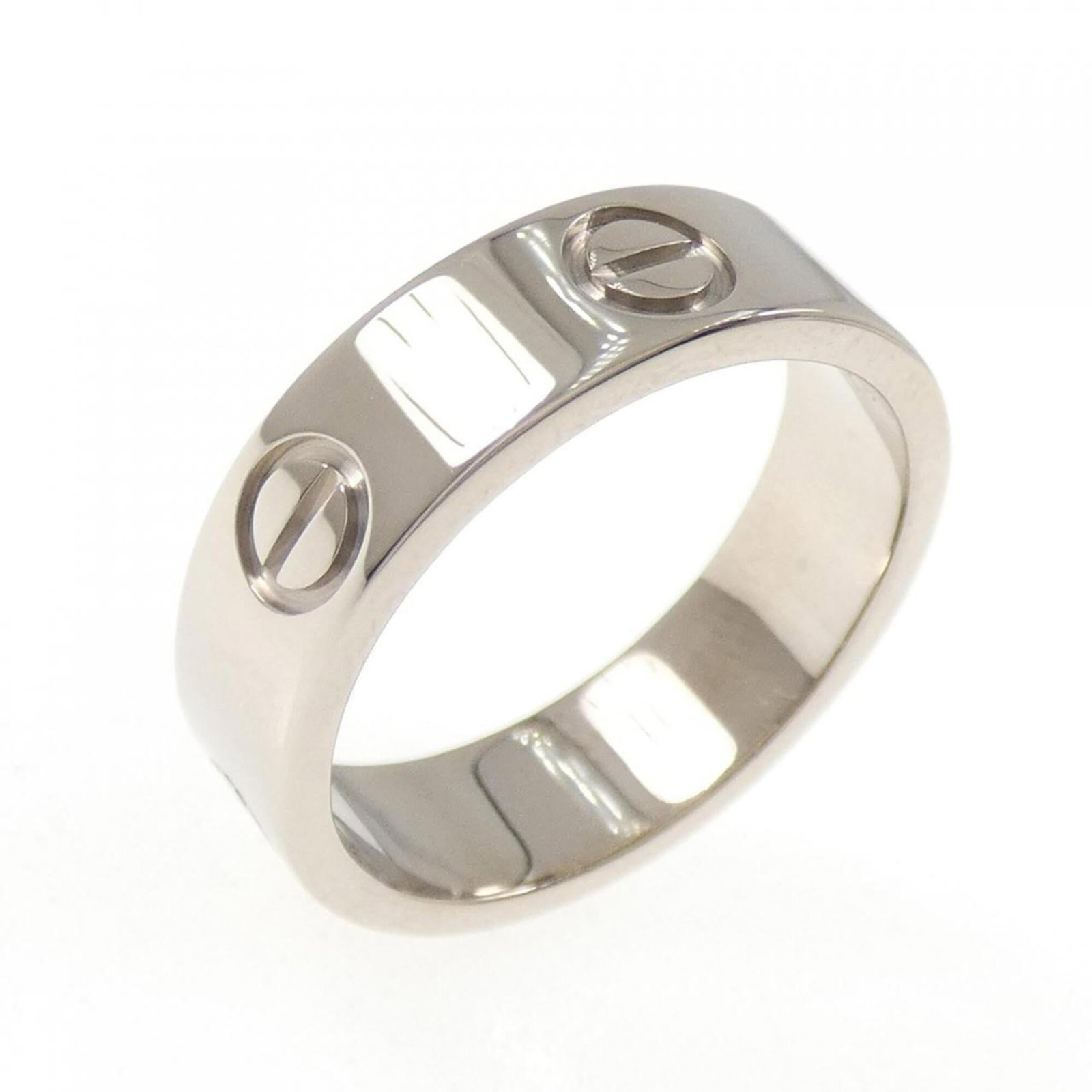 White Gold Cartier Band Ring 18K: White Gold Cartier Band Ring 18K White Gold Cartier Band Ring 18K - A high-end, pre-owned band ring from renowned luxury brand Cartier. Made from 18K white gold, this elegant piece features a classic