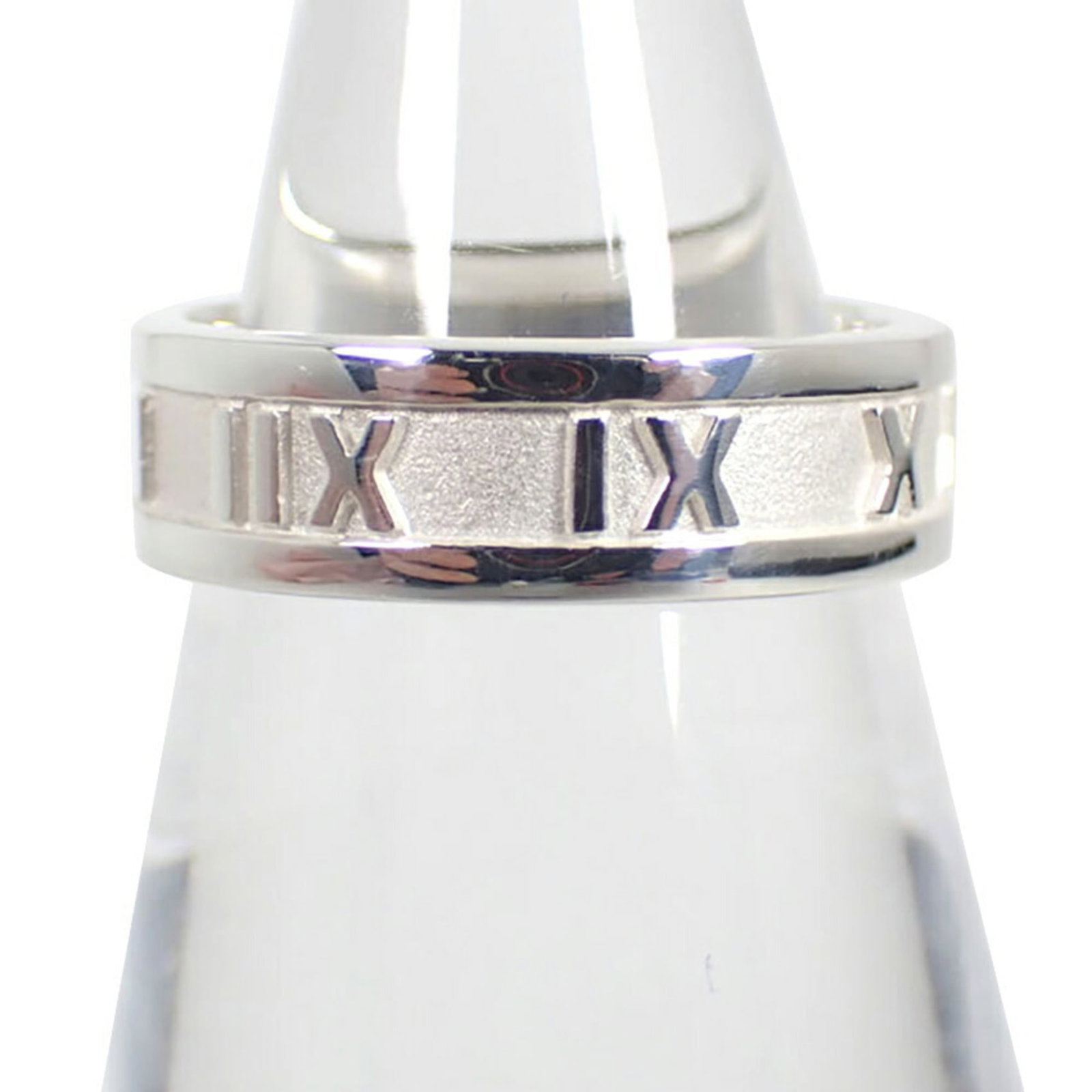 Sterling Silver Ring Tiffany Band: Sterling Silver Ring Tiffany Band Sterling silver ring from Tiffany, featuring a classic band design. The 52mm band size accommodates a US size 6.5 finger, with some minor scratches and dirt visible b