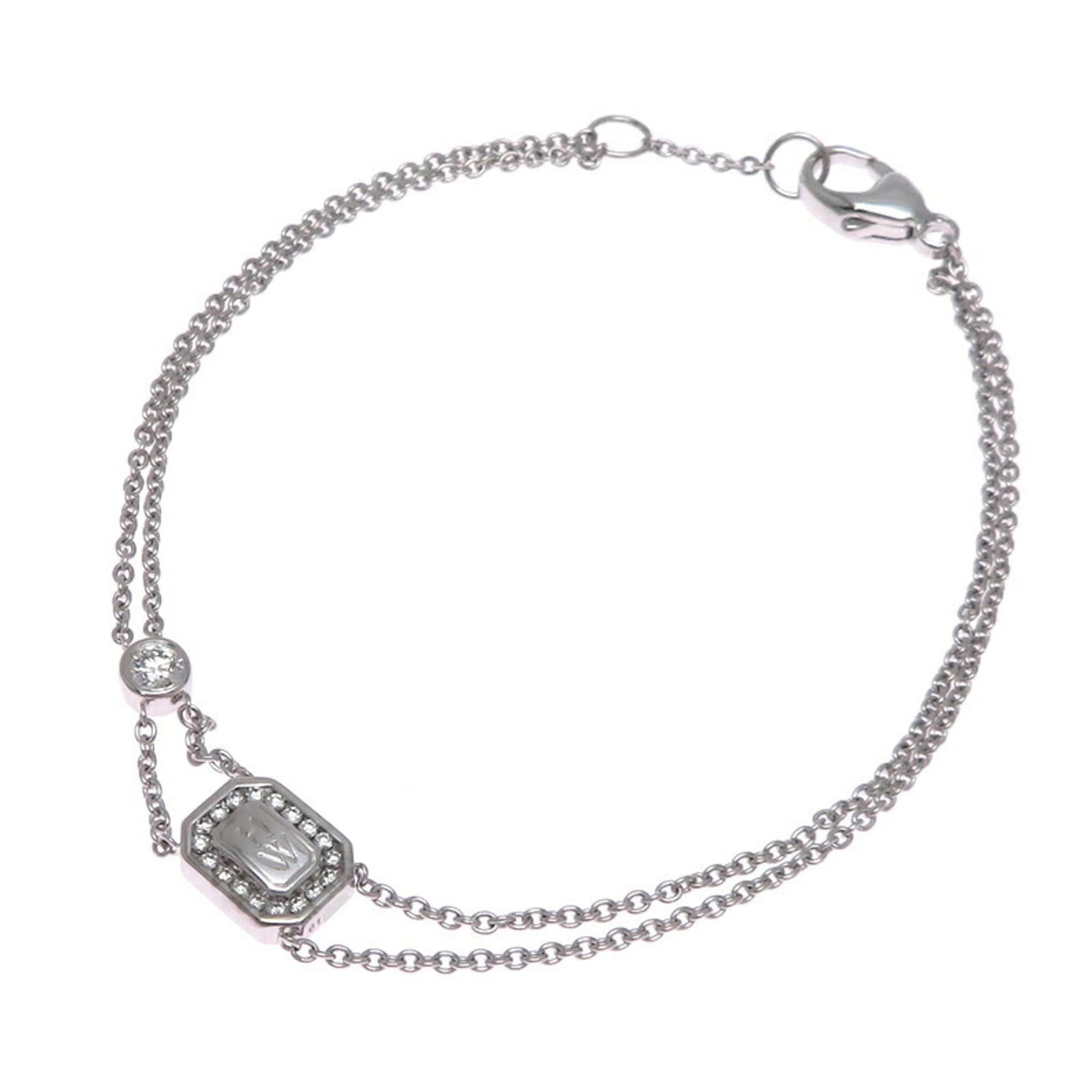 Harry Winston charm bracelet in white gold: Harry Winston charm bracelet in white gold In exquisite white gold, this Harry Winston charm bracelet boasts a stunning diamond stone. With its elegant design and slender profile, it adds a touch of s