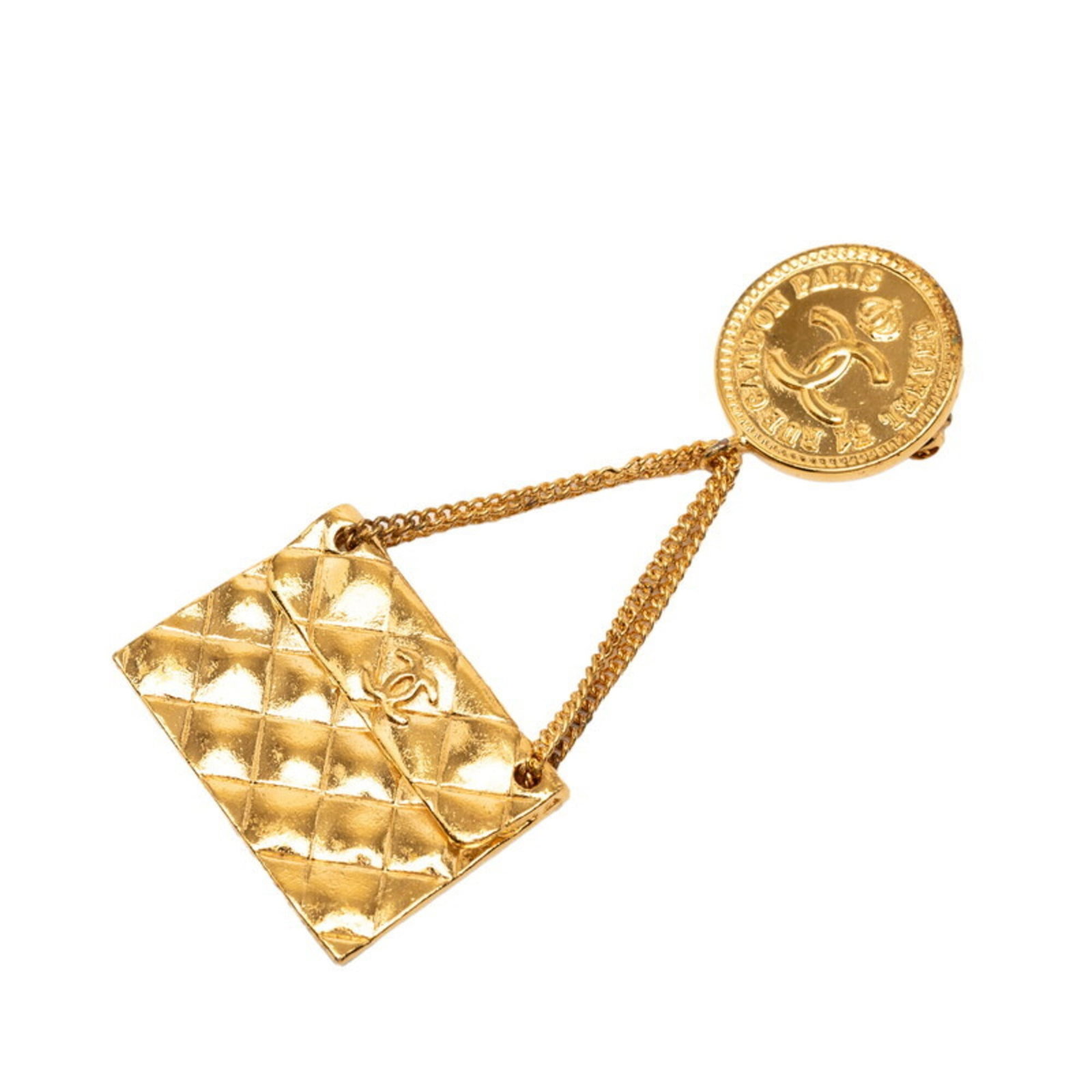 Chanel Brooch: Chanel Brooch Gold Chanel Brooch, 7.7cm x 3.5cm in size, bears the brand's signature style with a subtle sheen to its gold finish. The brooch has traces of usage and minor scratches, but remains in
