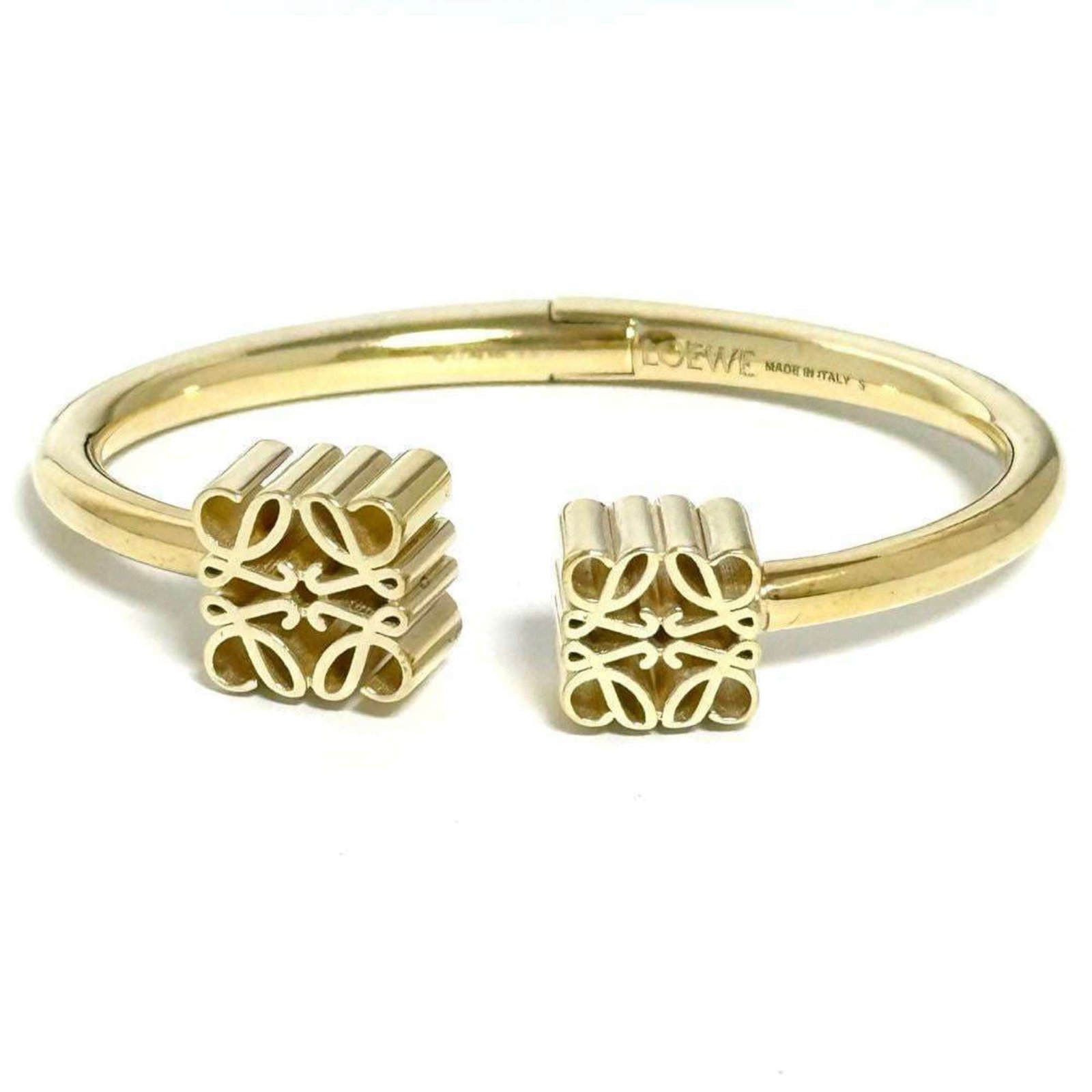 Loewe Bangle Silver 925: Loewe Bangle Silver 925 Silver 925 bangle from Loewe, bearing a signature, with a gold tone and measuring 14.5cm in length. The bangle has some traces of usage, including scratches and dirt, but is