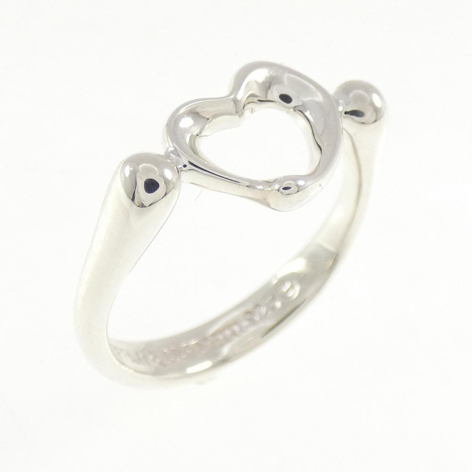 Open Heart Ring by Tiffany: Open Heart Ring by Tiffany Silver Open Heart Ring by Tiffany, featuring a classic design with a subtle touch of elegance. This 925 sterling silver ring has some minor scratches and dirt, but remains i