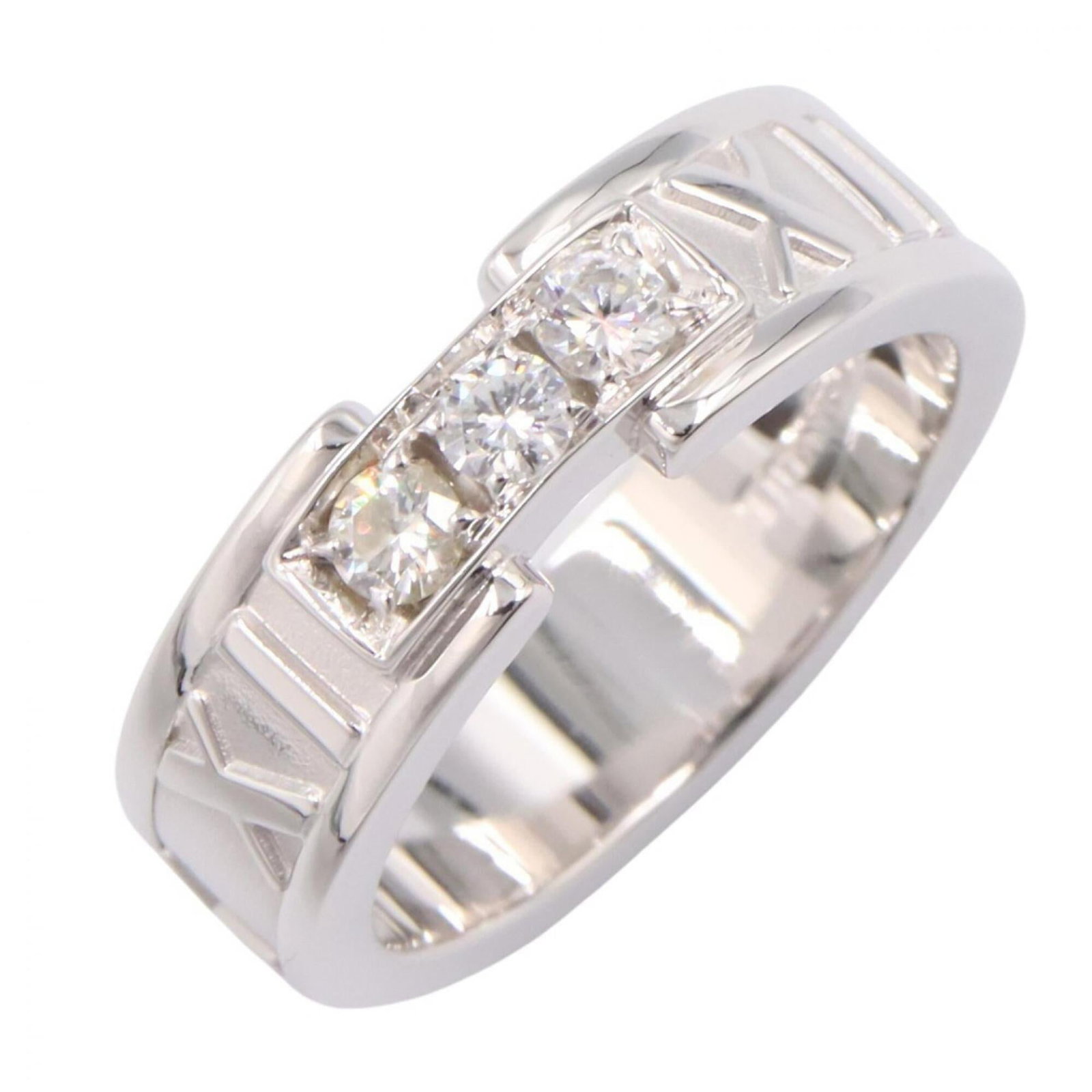 Tiffany Band Ring White Gold (18K): Tiffany Band Ring White Gold (18K) Tiffany Band Ring White Gold (18K) features a clear, silver diamond set in an 18K white gold band. The ring has some scratches and dirt, but overall remains in very 