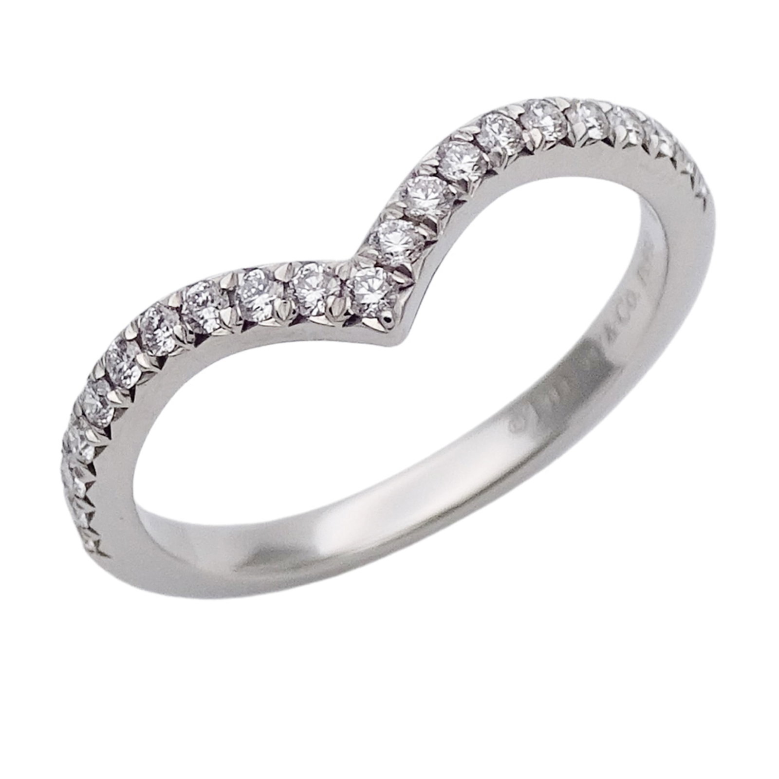 Platinum ring by Tiffany band: Platinum ring by Tiffany band Platinum ring by Tiffany features a silver band with a platinum 950 material, available in US size 5. The ring bears traces of usage and minor scratches/dirt, but remains