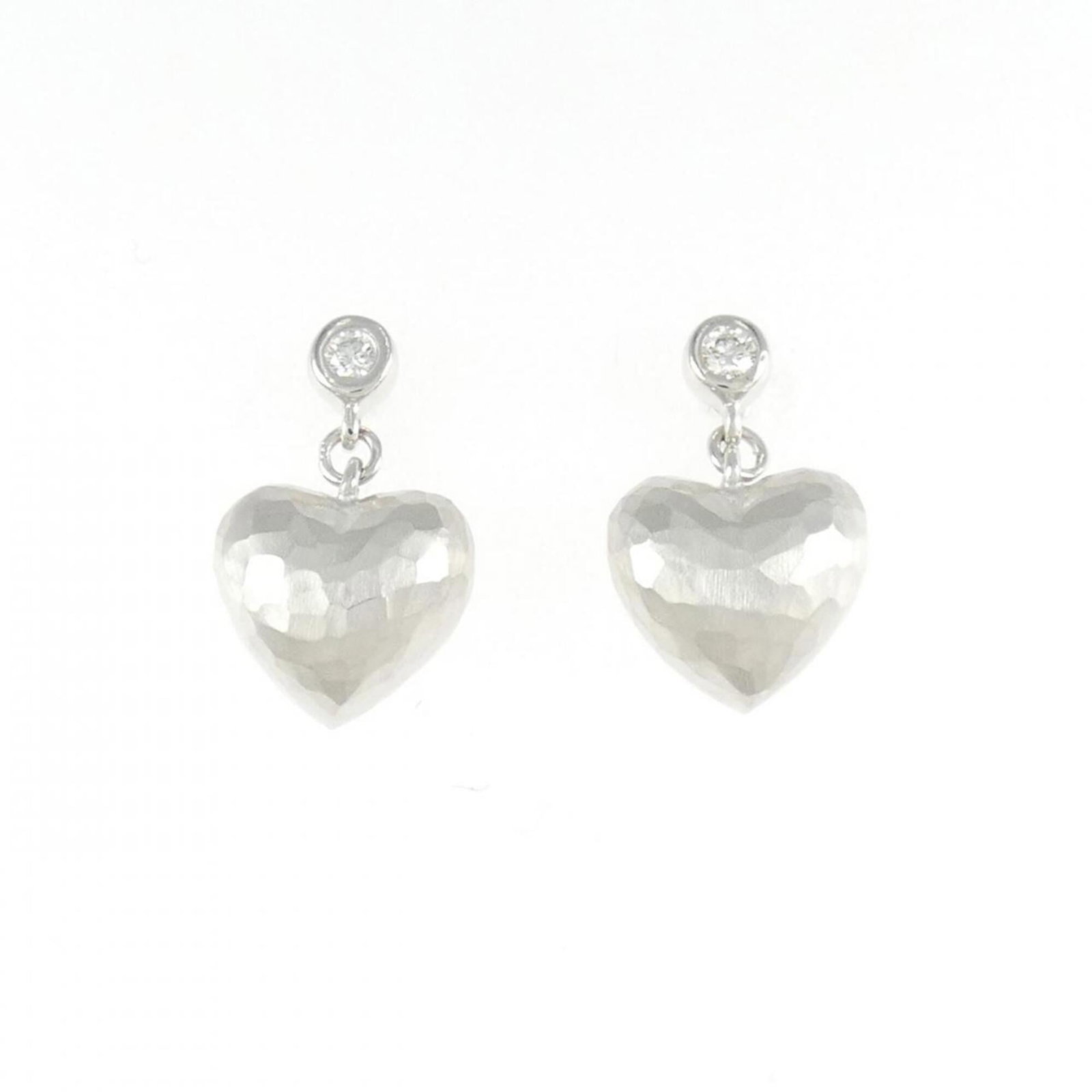 Hammered Heart Earrings by Tiffany: Hammered Heart Earrings by Tiffany Hammered Heart Earrings by Tiffany are a striking piece featuring white gold (18K) and a 15.60mm x 9.40mm stone, showcasing intricate details in their design. With