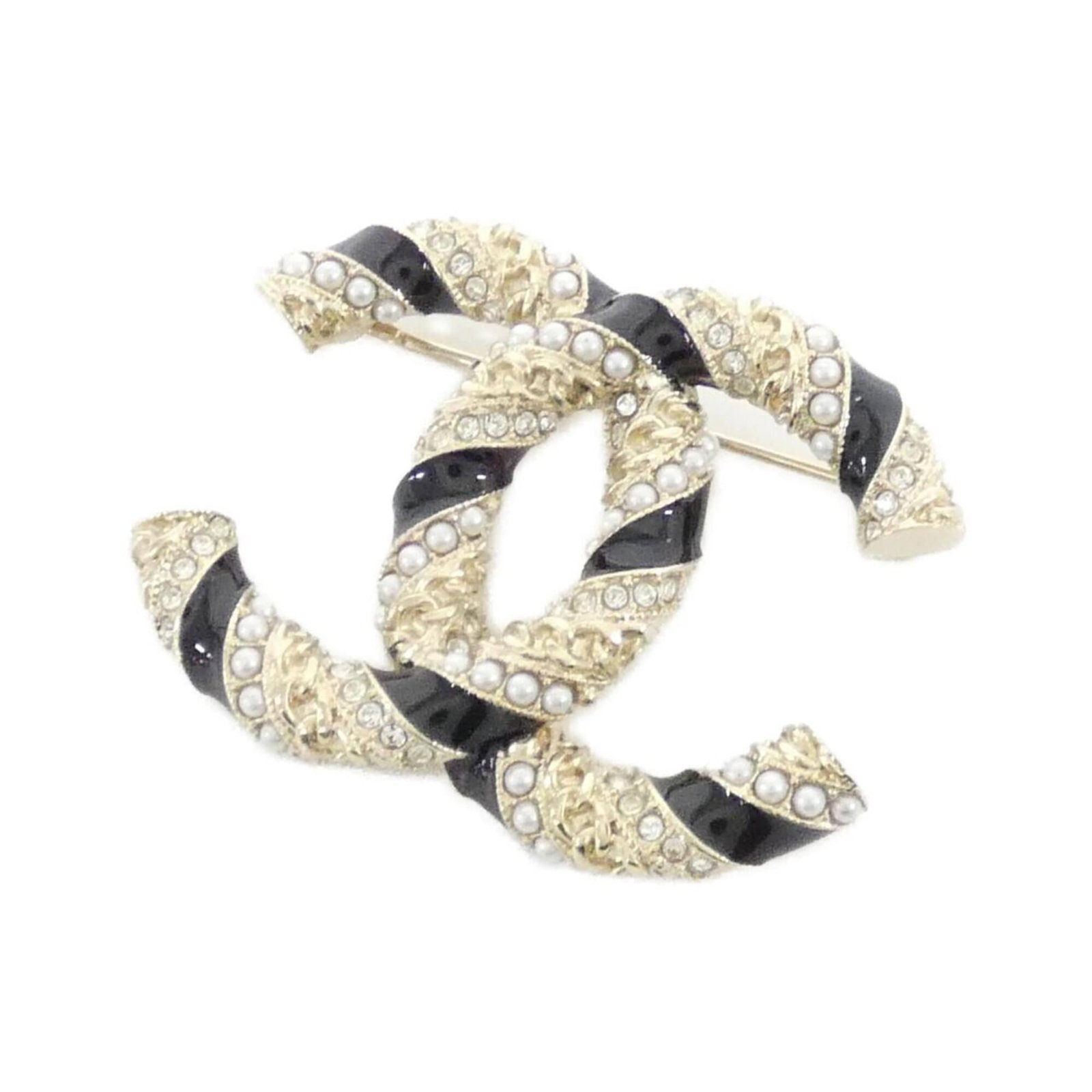 Chanel Brooch: Chanel Brooch This Chanel brooch boasts sleek black and gold details, set against a crisp white background. Measuring 3.9cm x 5cm, it adds a touch of timeless elegance to any outfit. With its subtle s