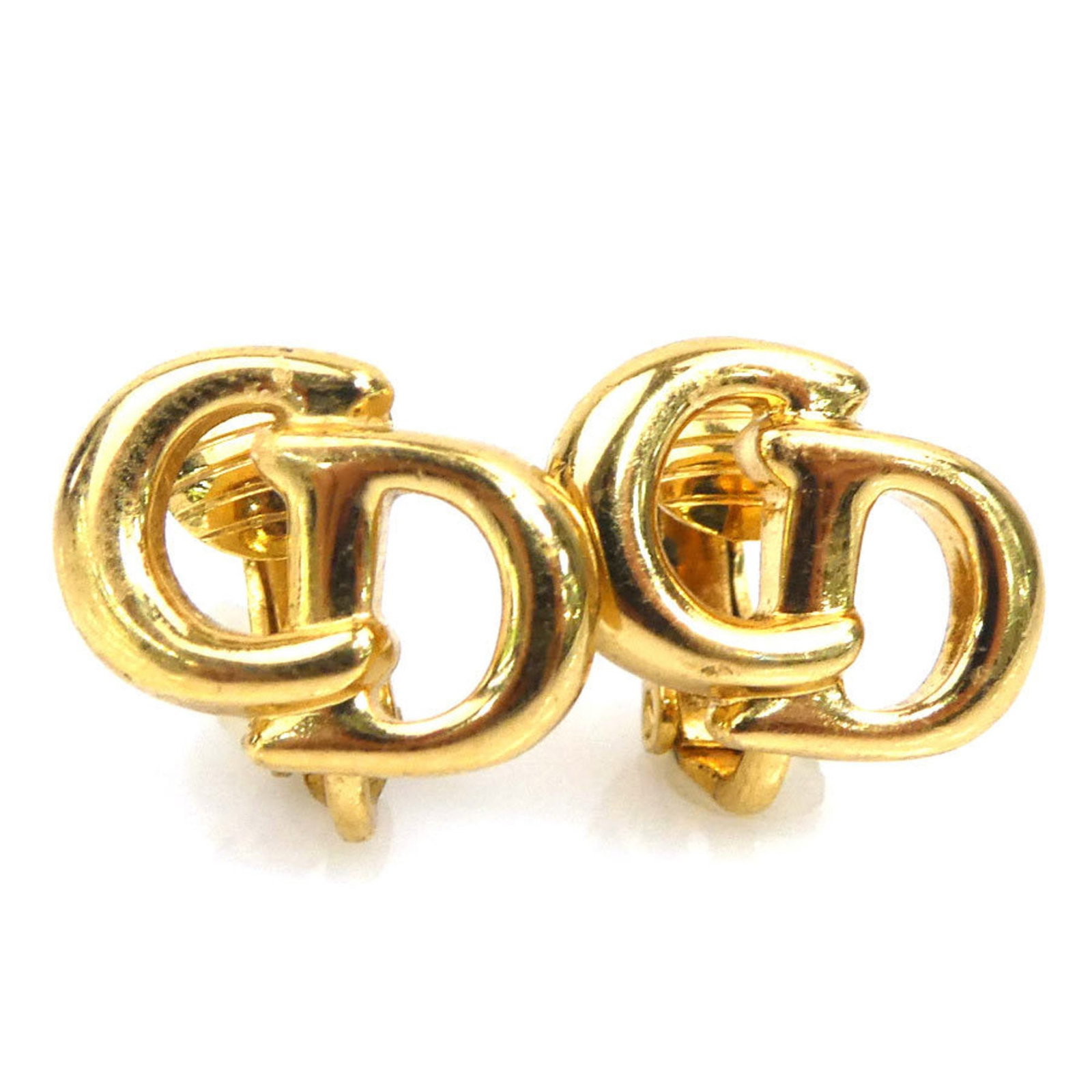 Metal clip earrings by Christian Dior: Metal clip earrings by Christian Dior Gold metal clip earrings by Christian Dior, bearing traces of usage and minor scratches. The earrings measure 10.00mm x 13.00mm in size. Used condition with visib