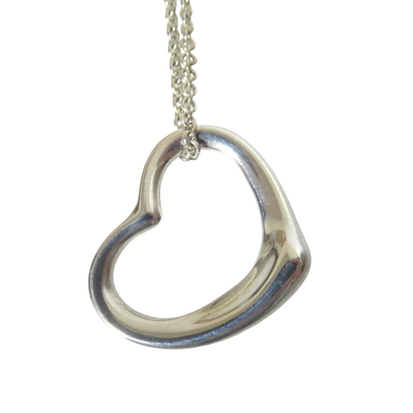 Silver Pendant Necklace Elsa Peretti Women's Tiffany & Co. 925 Open Heart: Silver Pendant Necklace Elsa Peretti Women's Tiffany & Co. 925 Open Heart Silver Pendant Necklace Elsa Peretti Women's Tiffany & Co. 925 Open Heart features a beautiful open heart design in sterling s