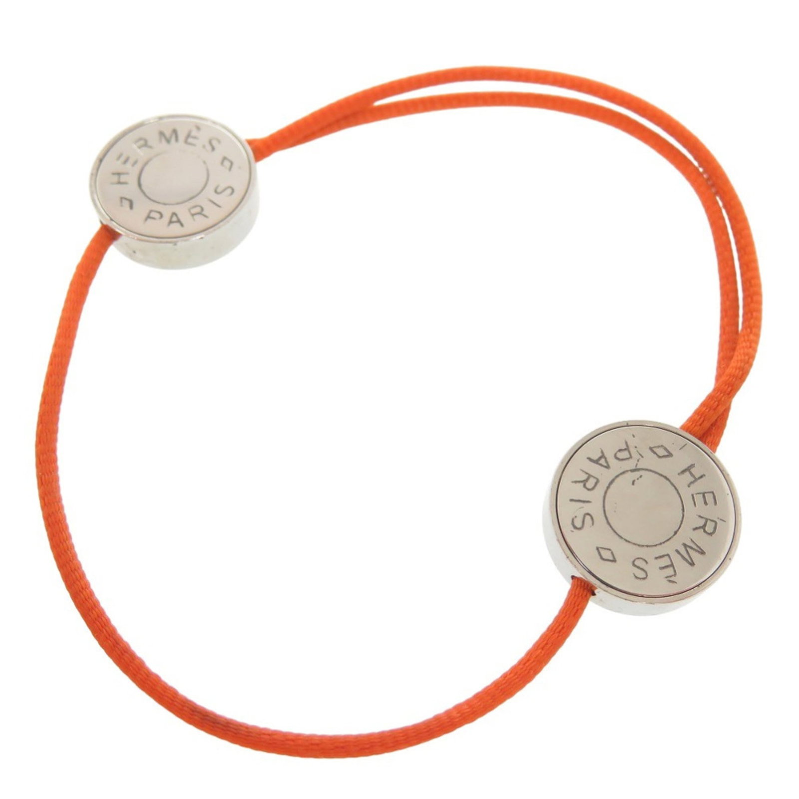 Metal friendship bracelet by Hermes: Metal friendship bracelet by Hermes This vibrant orange and silver metal friendship bracelet from Hermes boasts a unique blend of style and elegance. Measuring between 17cm to 23cm, it features