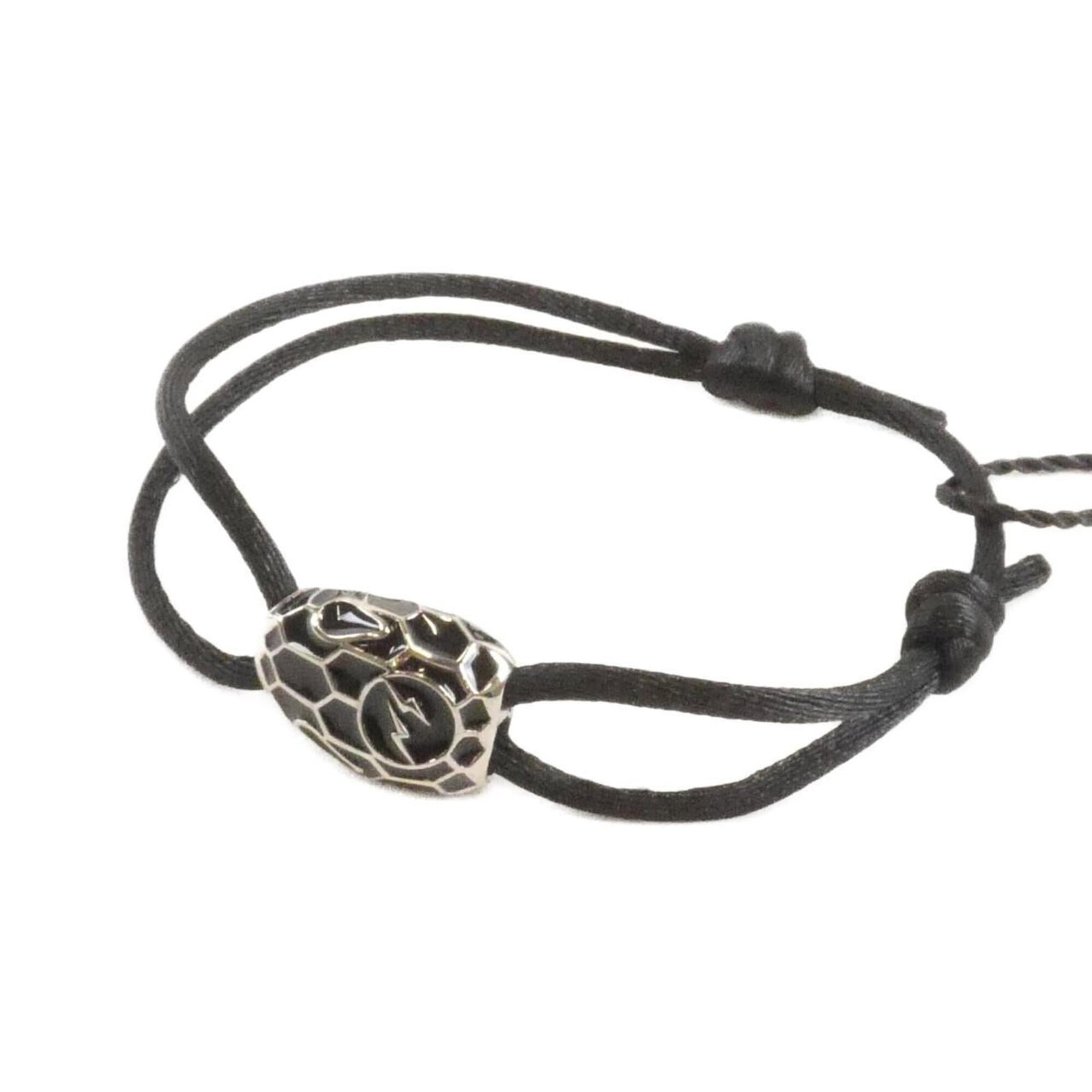 Bvlgari Charm Silk Bracelet: Bvlgari Charm Silk Bracelet The Bvlgari Charm Silk Bracelet boasts sleek black silk in a timeless design, measuring 21cm in length. With its elegant charm style and luxurious material, this bracelet e