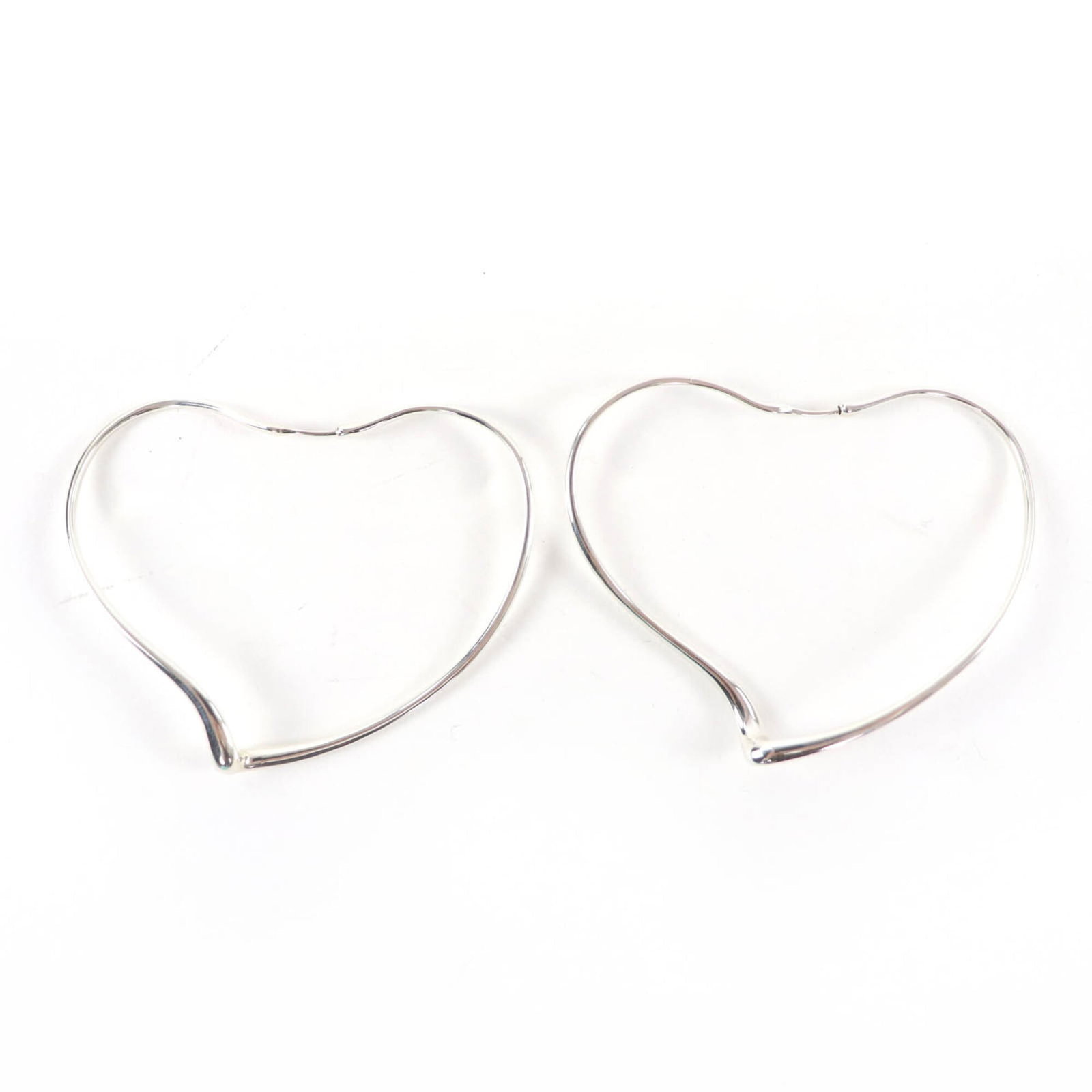 Tiffany Hoop Earrings Silver 925: Tiffany Hoop Earrings Silver 925 Silver 925 Tiffany Hoop Earrings with a sleek and modern design, measuring 50.00mm x 63.00mm in size, are available for purchase. Made from high-quality silver materia