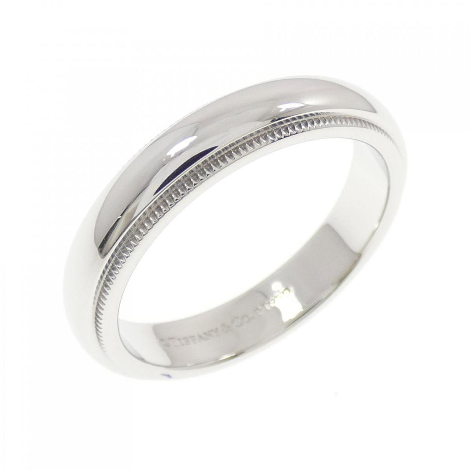 Platinum ring by Tiffany band: Platinum ring by Tiffany band Made from platinum, this Tiffany band ring boasts a sleek design with a width of 4mm and a US size of 7.5. The ring's weight is 8.9g, making it substantial without being 