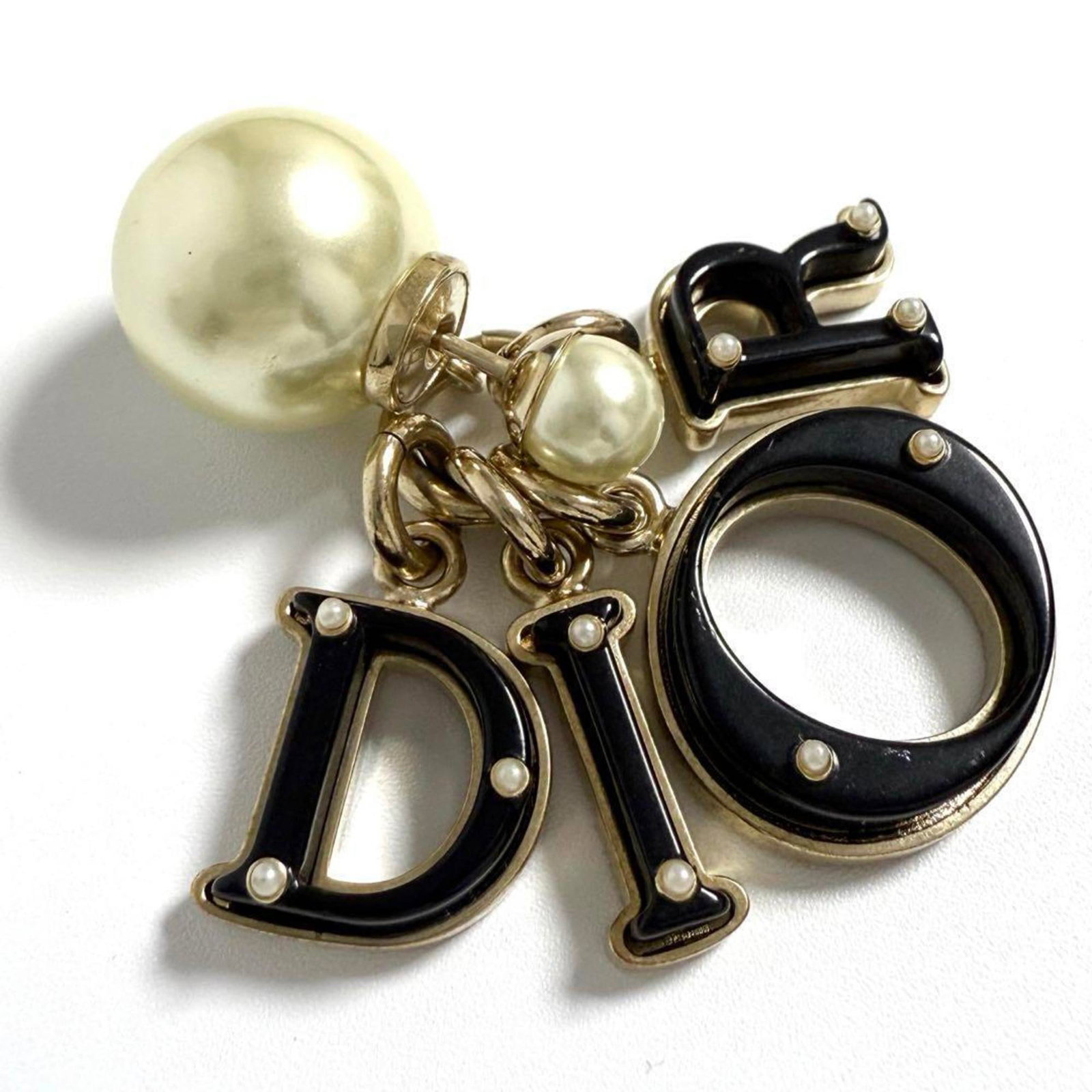 Stud Earrings by Metal from Christian Dior: Stud Earrings by Metal from Christian Dior Stud earrings from Christian Dior's metal collection, bearing the brand's signature style. The used condition showcases some minor scratches and dirt, but