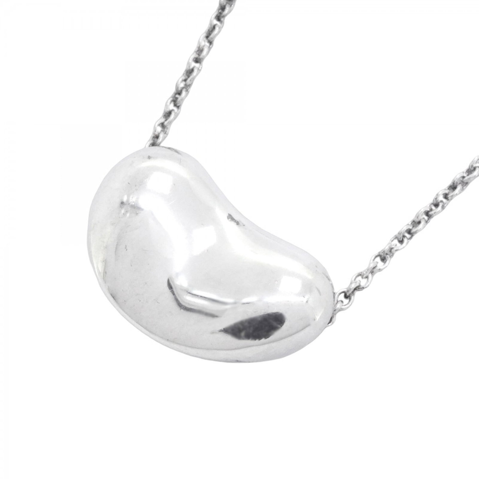 Tiffany & Co. Bean Necklace Sterling Silver 925 Women'S: Tiffany & Co. Bean Necklace Sterling Silver 925 Women'S Tiffany & Co. Bean Necklace in Sterling Silver 925 features a classic design with a pendant size of 13.1mm x 20.7mm, set against a silver 925 ch