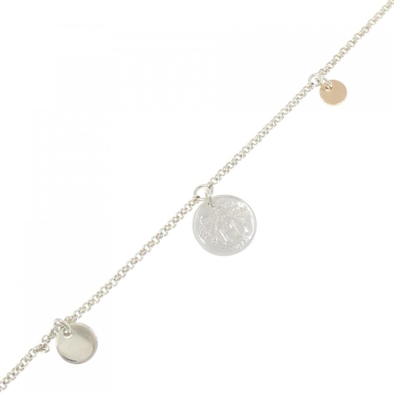 Charm bracelet pink gold silver 925 by Hermes: Charm bracelet pink gold silver 925 by Hermes Pink gold and silver 925 charm bracelet by Hermes, measuring 16cm in length. This used item has hardly any traces of usage, presenting a like-new