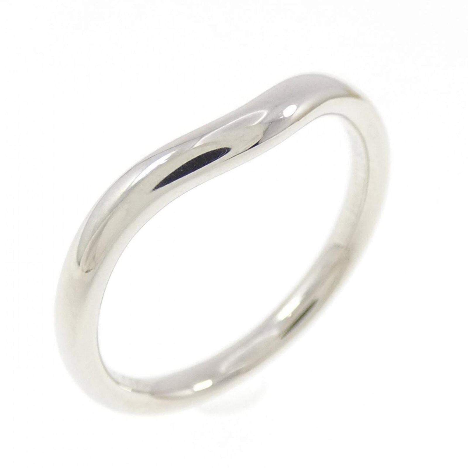 Platinum ring by Tiffany band: Platinum ring by Tiffany band Platinum ring by Tiffany features a band style design made from high-quality platinum. The item shows signs of usage, with a few scratches and dirt visible, but remains i