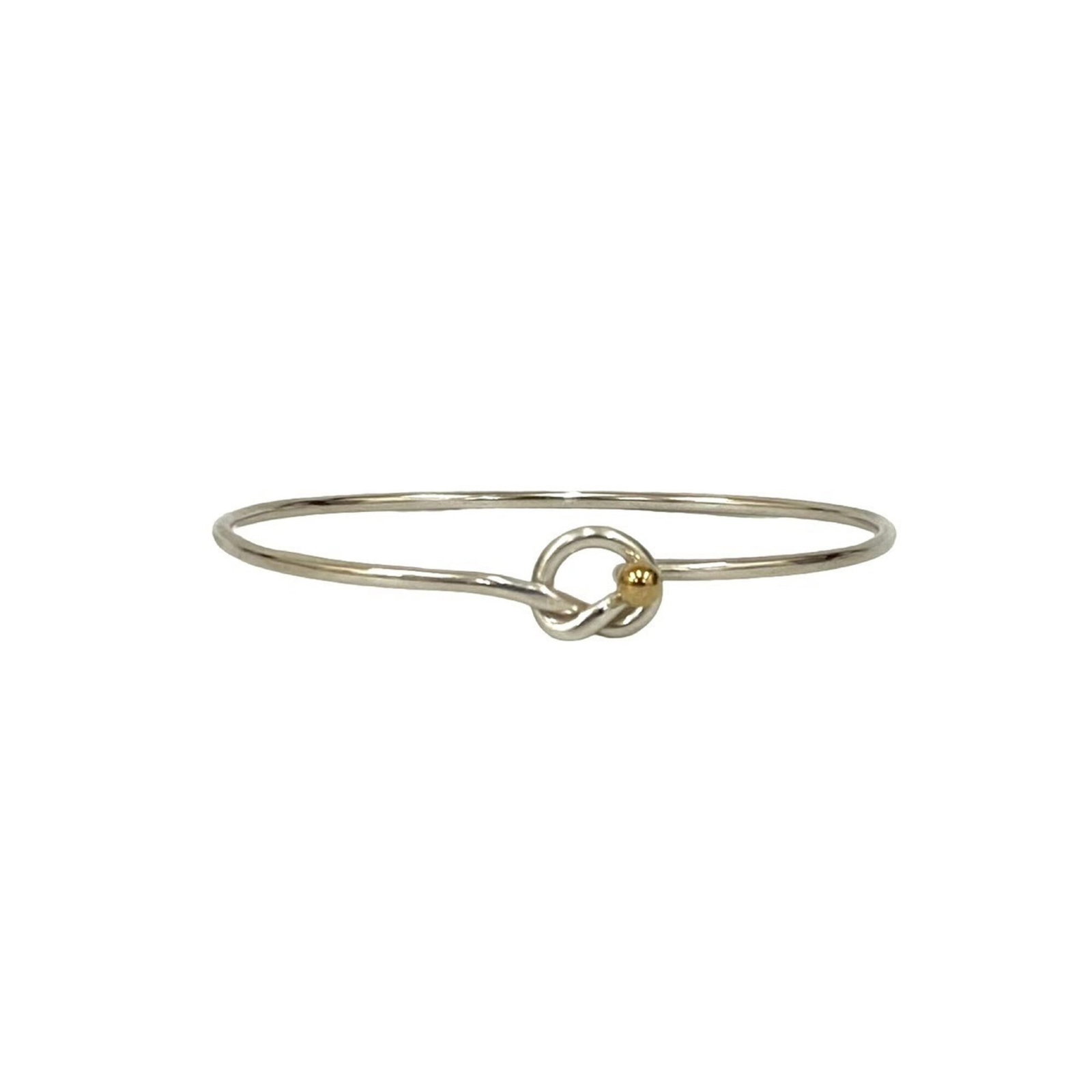 Tiffany Bangle Gold (18K) Silver 925: Tiffany Bangle Gold (18K) Silver 925 Tiffany Bangle Gold (18K) Silver 925 - A Timeless Accessory. This 17cm gold bangle features a combination of 18K gold and silver, adding a touch of elegance to any