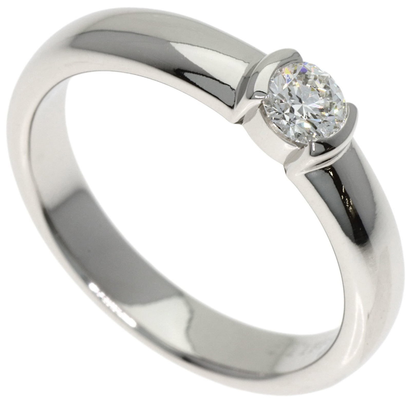 Tiffany Band Ring: Tiffany Band Ring Platinum band ring from Tiffany, featuring a 0.2 carat diamond set in a Vs2 clarity stone, with a platinum purity of 950 and a comfortable us size 5. The ring has some minor