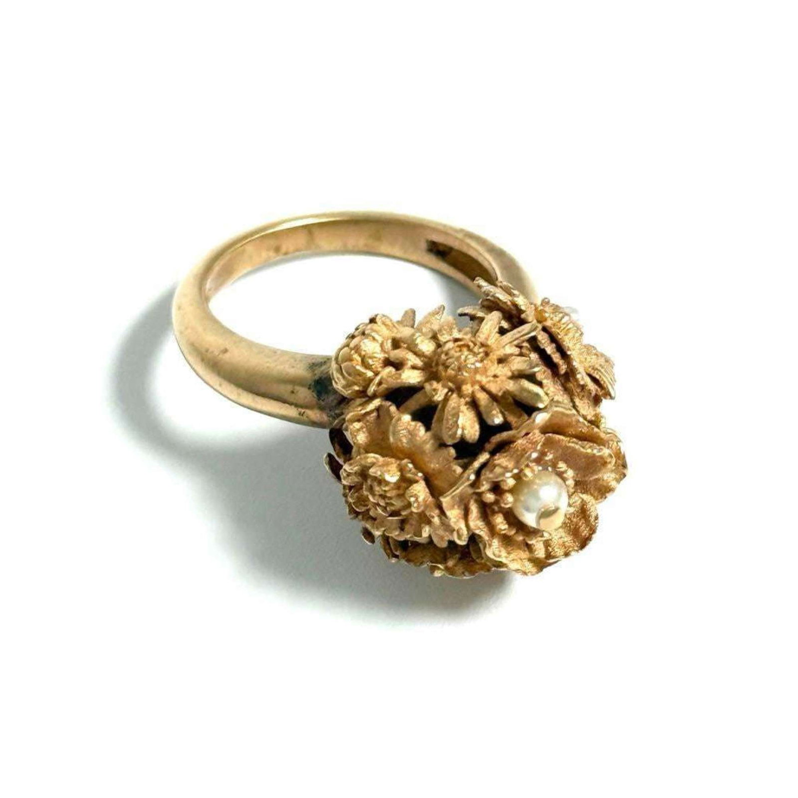 Christian Dior Band Ring Artificial Pearl Metal: Christian Dior Band Ring Artificial Pearl Metal Pink Gold Band Ring with Artificial Pearl Details. This Christian Dior band ring features artificial pearl accents, adding a touch of elegance to its me
