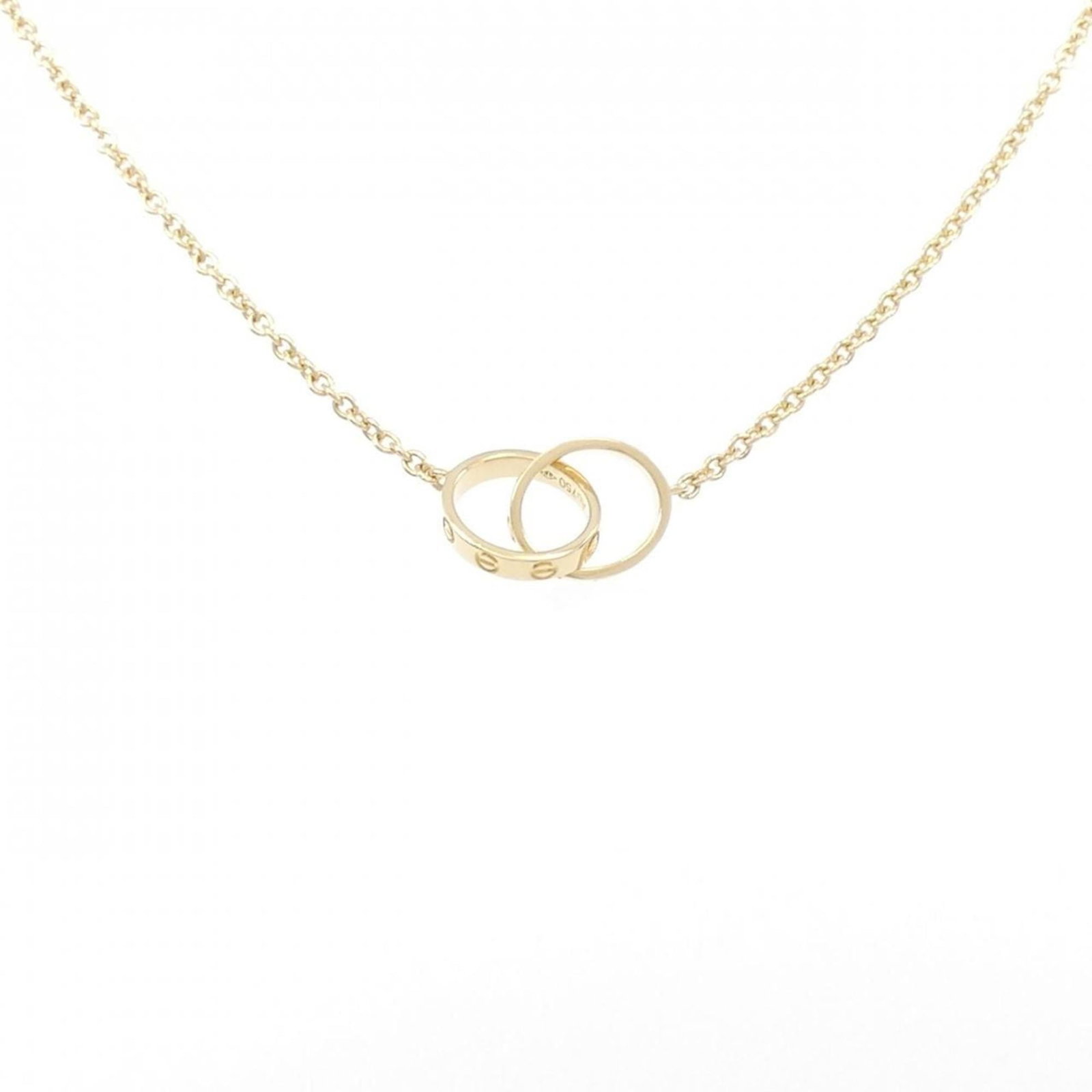 Love Baby Cartier Necklace: Love Baby Cartier Necklace The Love Baby Cartier Necklace boasts a sleek design with a few traces of usage, some scratches and dirt visible. A few minor imperfections add to its worn-in charm, making 