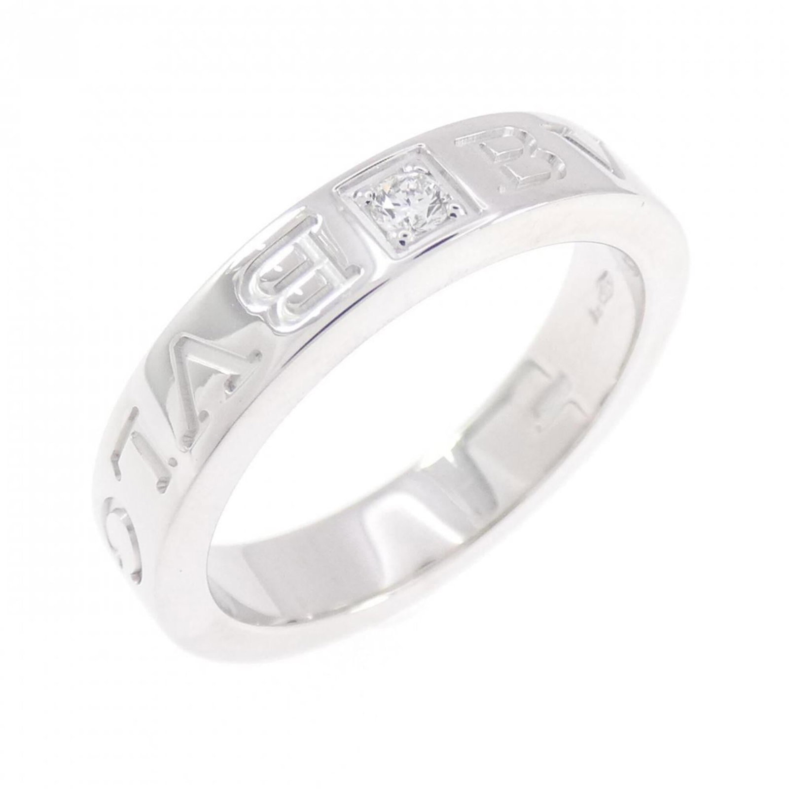 Bvlgari Band Ring White Gold (18K): Bvlgari Band Ring White Gold (18K) Bvlgari Band Ring White Gold (18K) features a stunning white gold band adorned with a diamond, showcasing the luxury brand's signature style. This 18K white gold rin