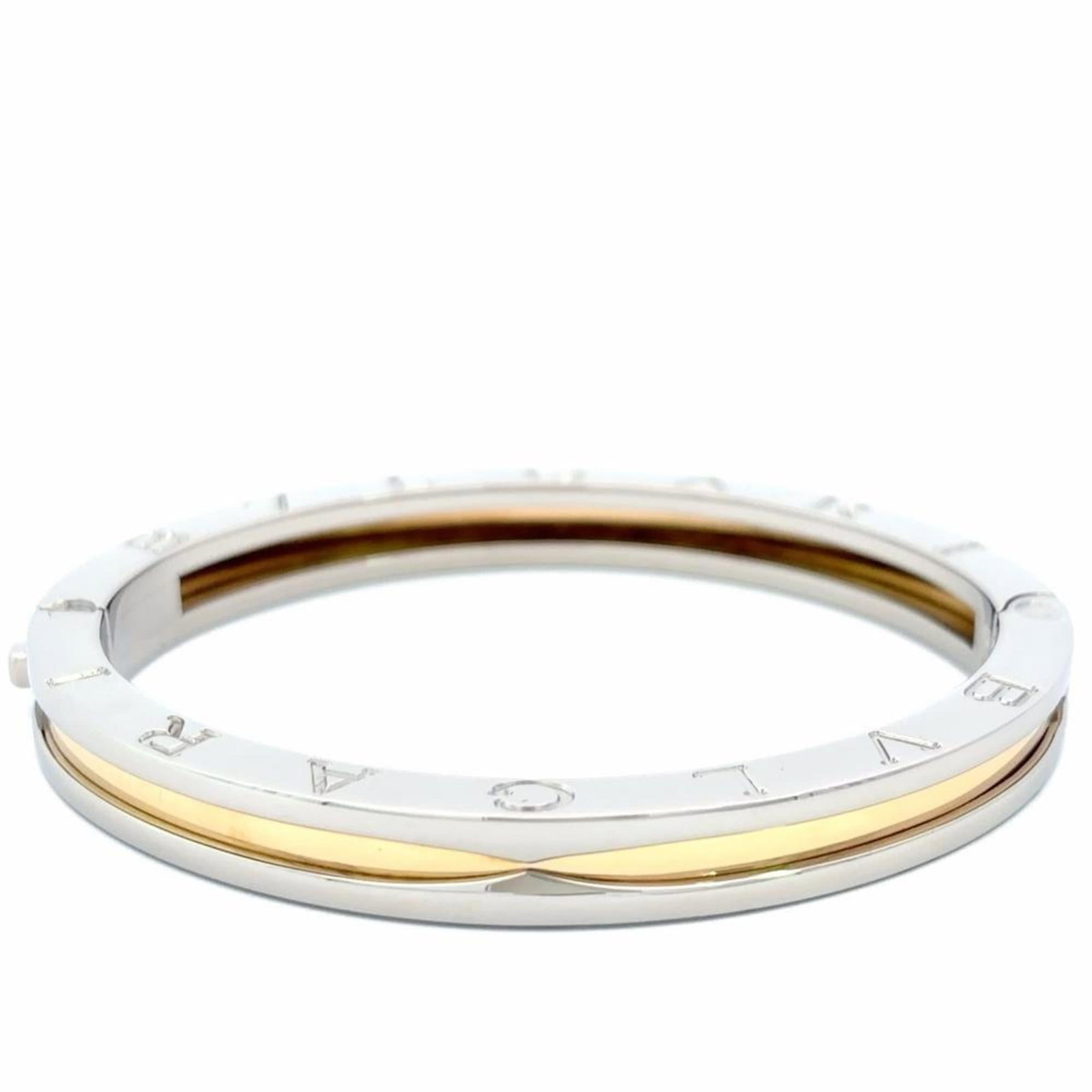 Bvlgari Bangle Stainless Steel Yellow Gold (18K): Bvlgari Bangle Stainless Steel Yellow Gold (18K) Stainless Steel and Yellow Gold (18K) Bangle from Bvlgari, featuring a classic design with subtle scratches and minor dirt marks that add to its