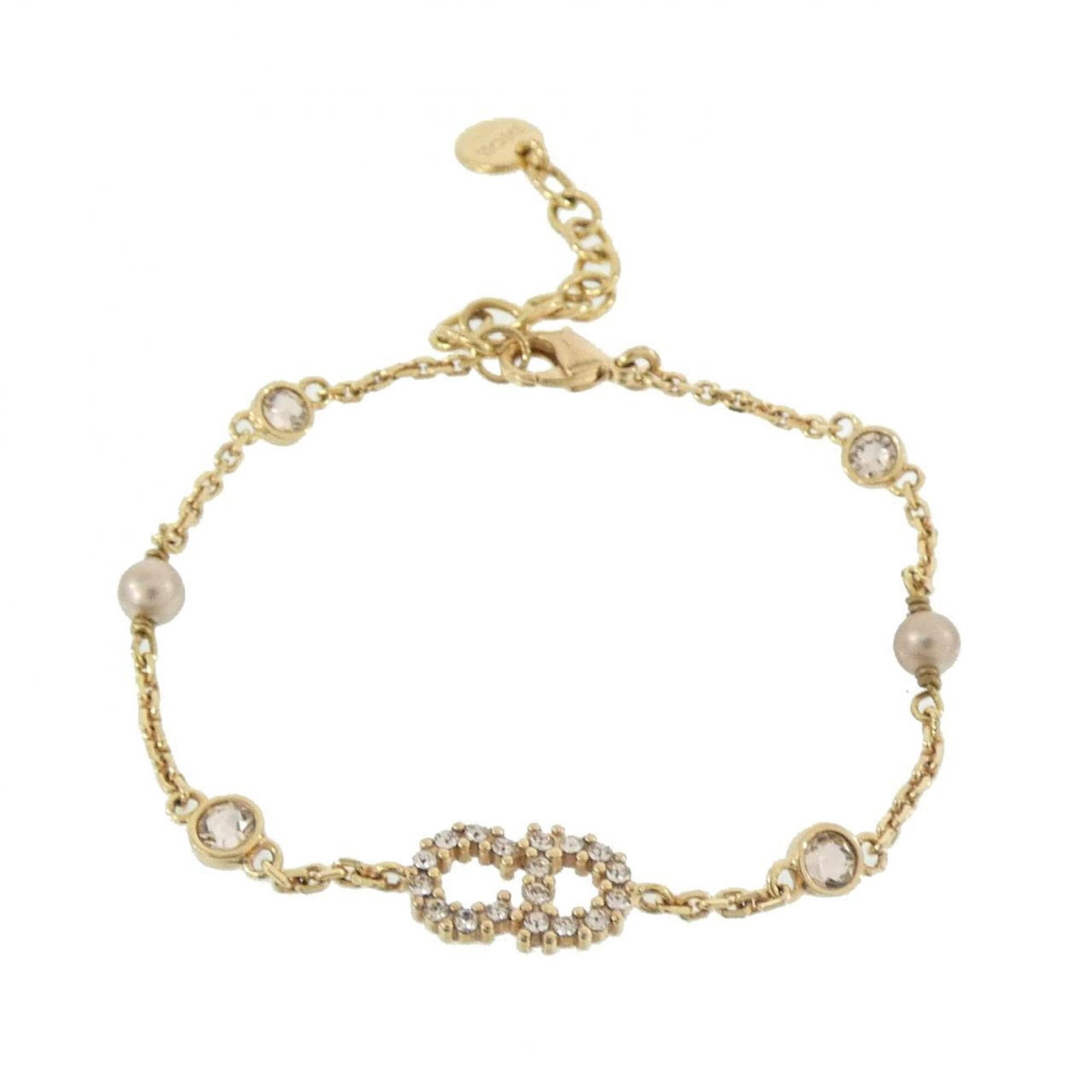 Dior Charm Christian: Dior Charm Christian Pink Dior Charm Christian bracelet in pink gold, featuring a classic charm design. Measuring 16cm-19cm in length, this used bracelet shows some signs of wear, including minor scra