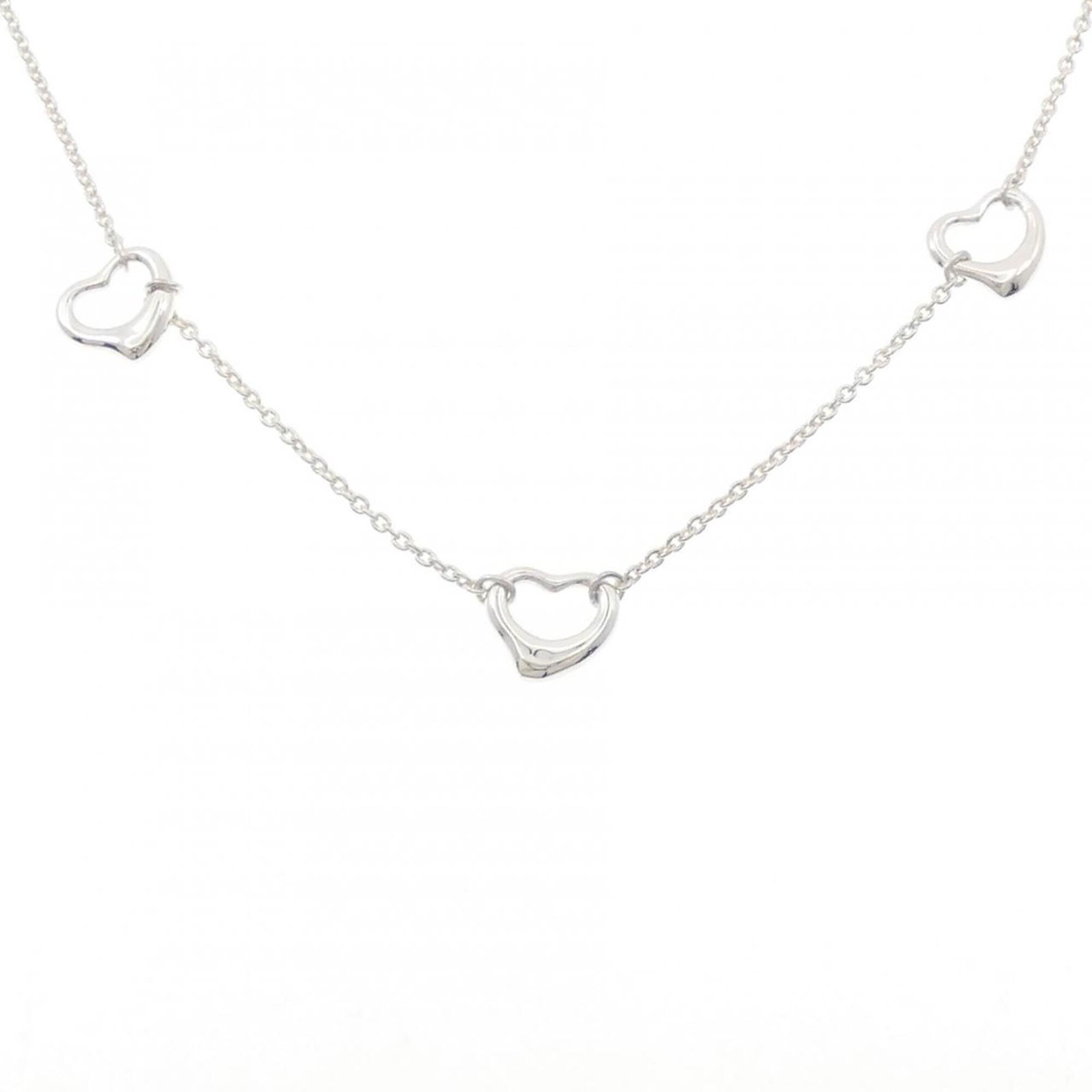Heart Open Tiffany Necklace: Heart Open Tiffany Necklace A few traces of usage and minor scratches can be seen on the Heart Open Tiffany Necklace, but overall it remains in very good condition. This 925 silver necklace features a