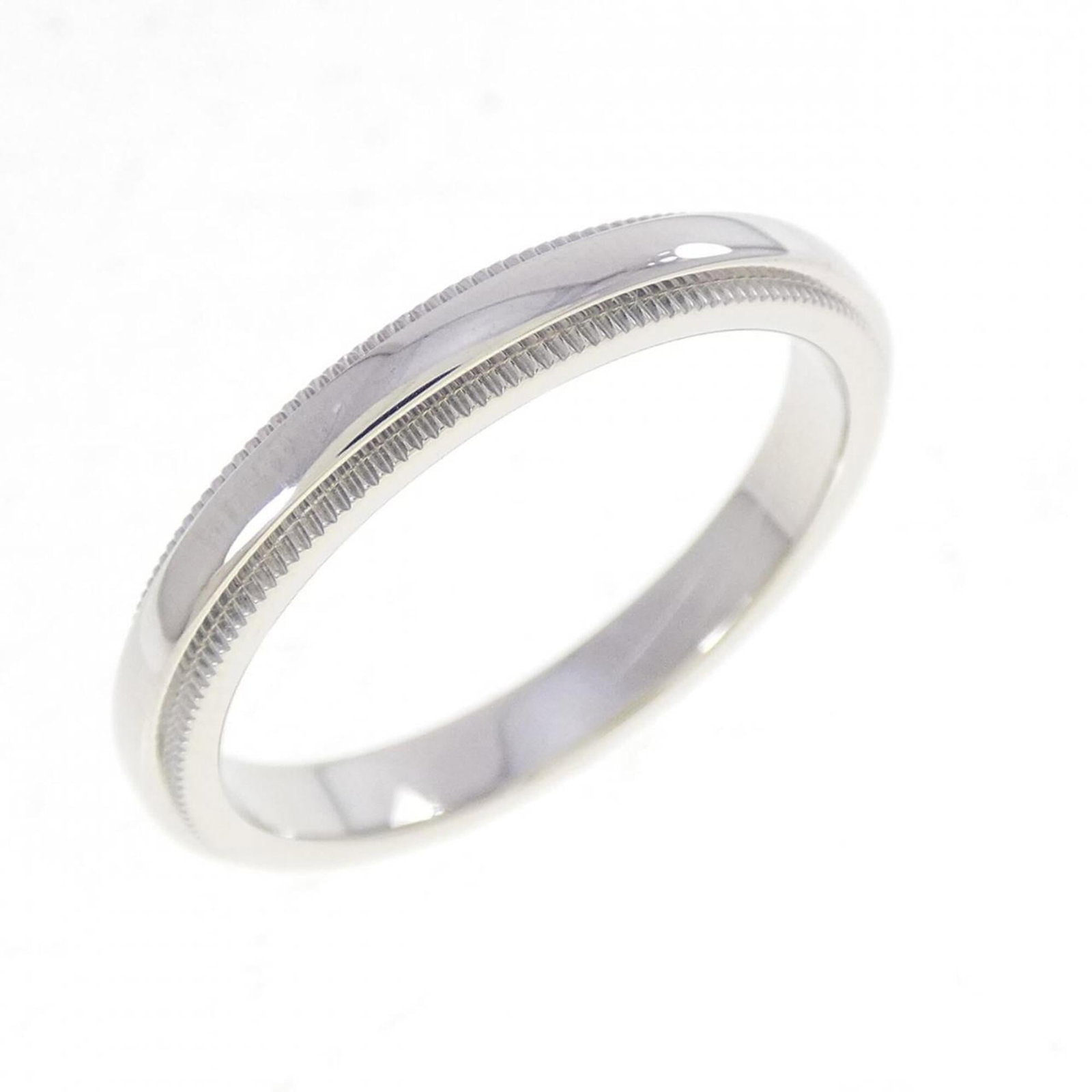 Platinum ring by Tiffany band: Platinum ring by Tiffany band Platinum ring by Tiffany features a band design made from high-quality platinum, available in a women's size 8. The item shows some signs of usage, with minor scratches